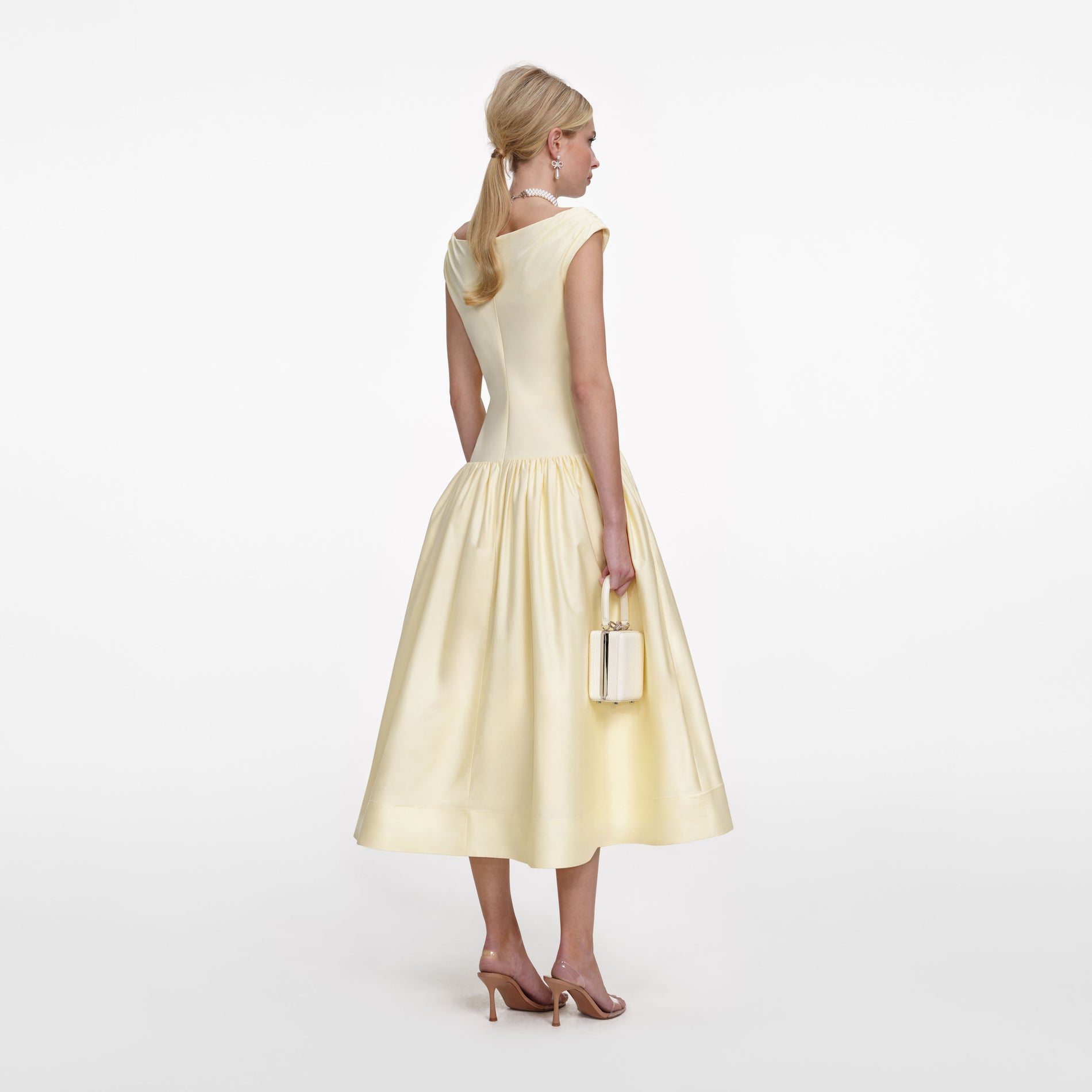 Back view of a woman wearing the Yellow Cotton Midi Dress