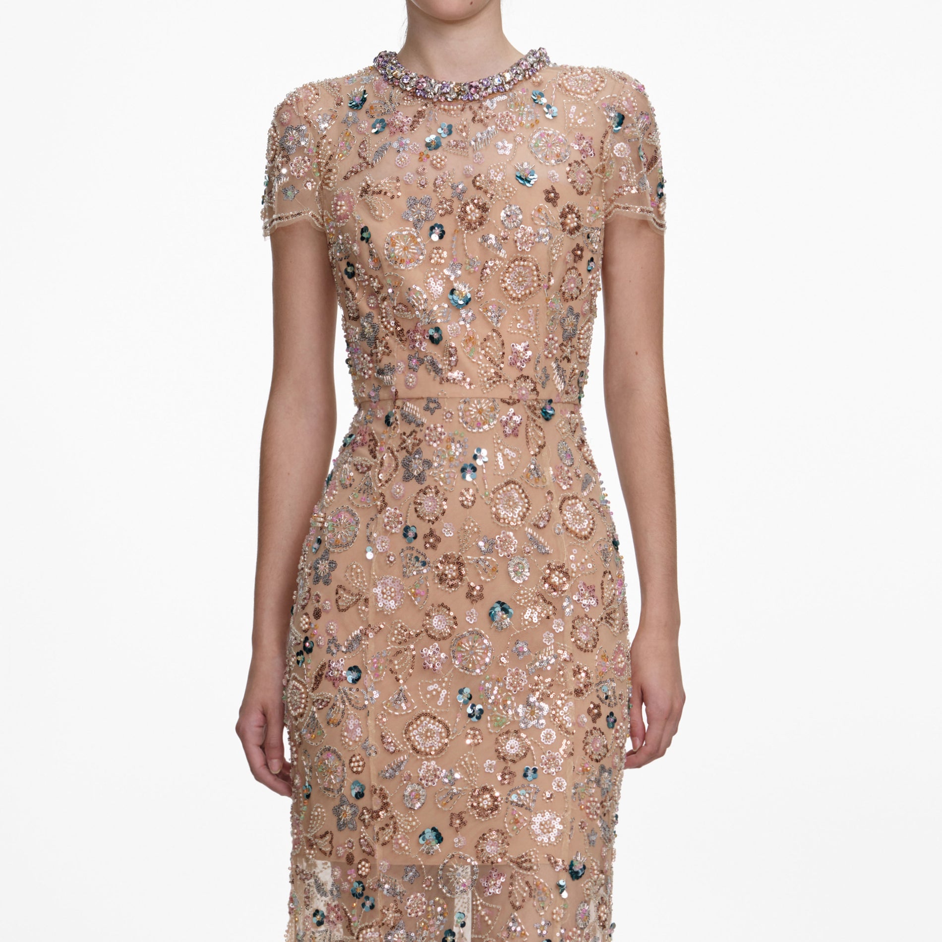 A close up of a woman wearing the Champagne Sequin Embroidered Maxi Dress