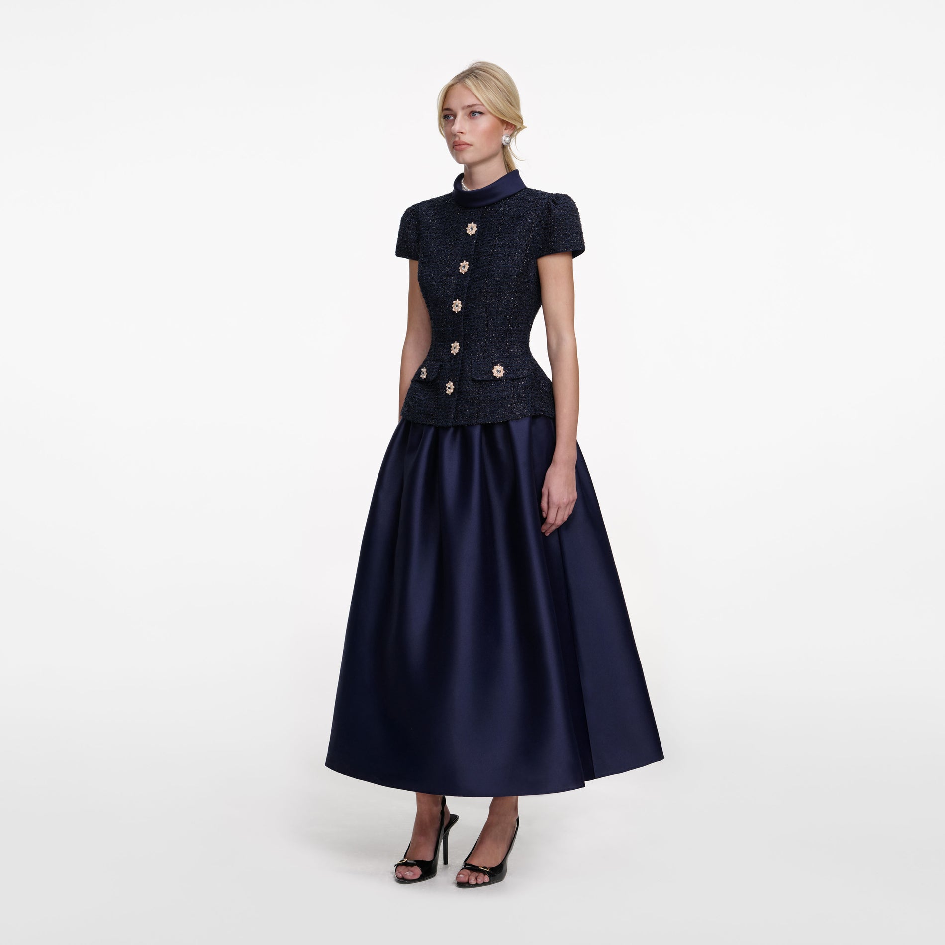 Side view of a woman wearing the Navy Metallic Boucle Taffeta Midi Dress