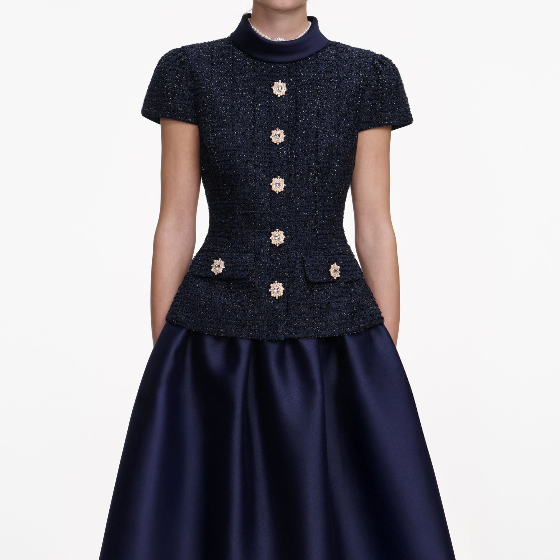 A close up of a woman wearing the Navy Metallic Boucle Taffeta Midi Dress