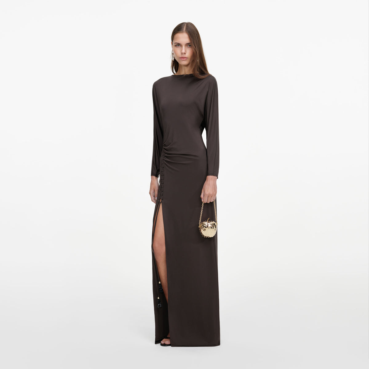 Side view of a woman wearing the Brown Jersey Open Back Maxi Dress