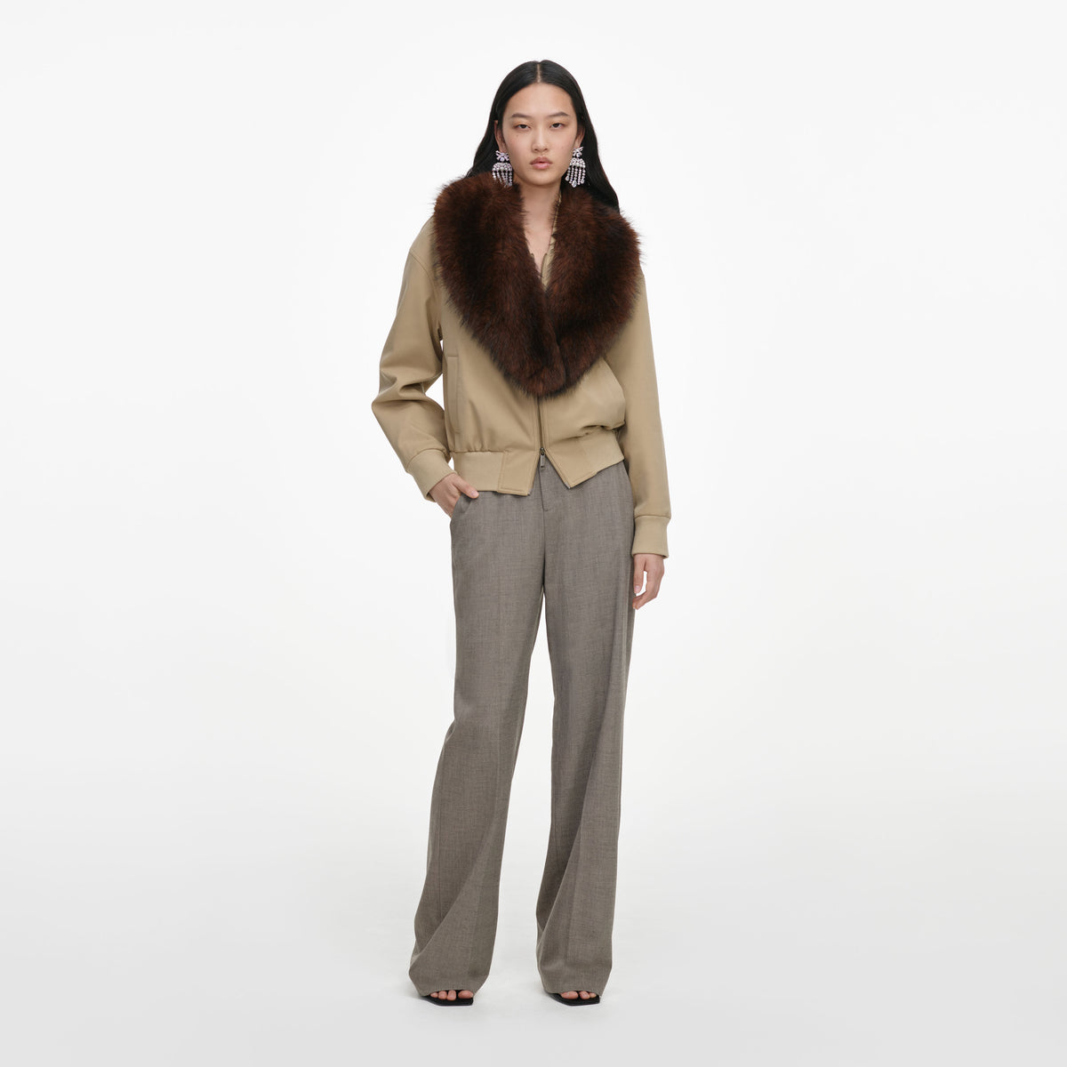 Front view of a woman wearing the Beige Faux Fur Bomber Jacket