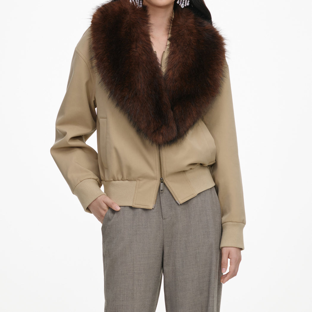 A close up of the fabric for the Beige Faux Fur Bomber Jacket