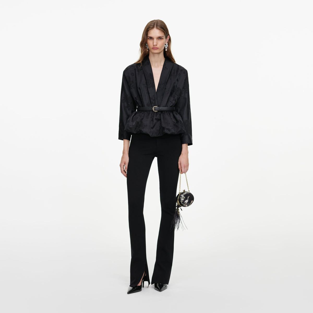 Front view of a woman wearing the Black Jacquard Peplum Top