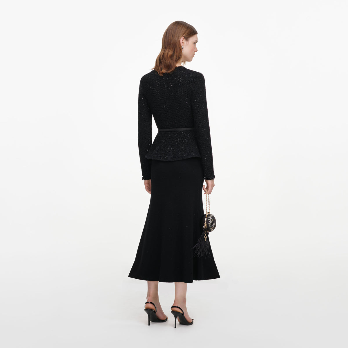 Back view of a woman wearing the Black Sequin Knit Midi Dress