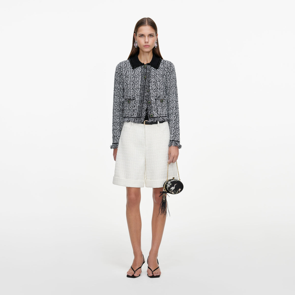 Front view of a woman wearing the Cream Sequin Boucle Tailored Shorts