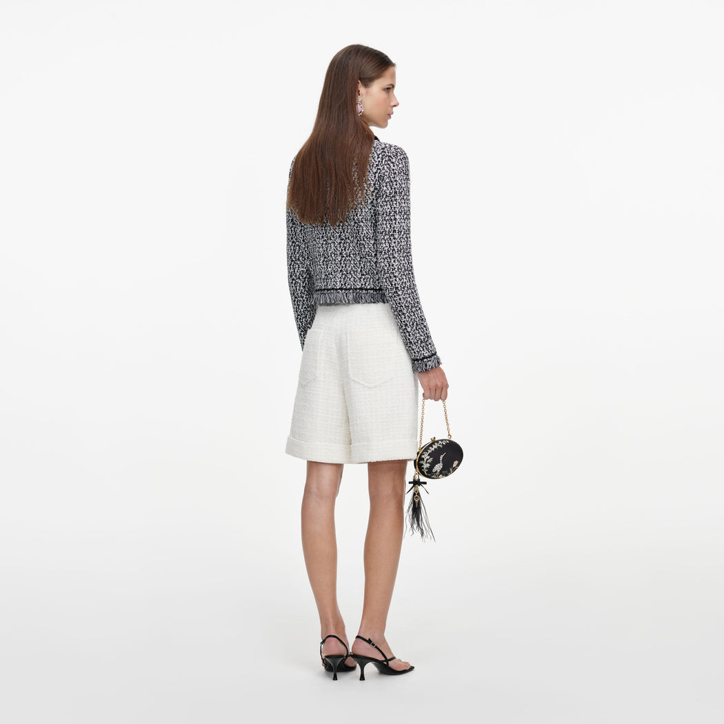Back view of a woman wearing the Cream Sequin Boucle Tailored Shorts