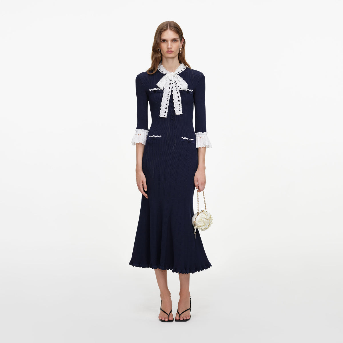 Front view of a woman wearing the Navy Pointelle Lace Knit Midi Dress
