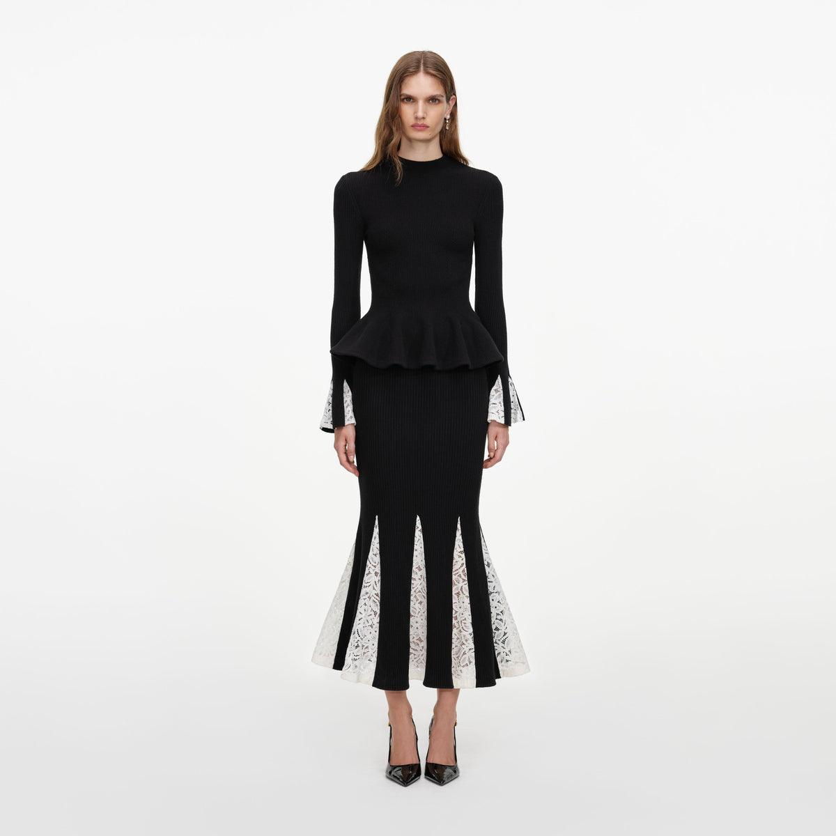 Front view of a woman wearing the Black Lace Insert Knit Midi Dress