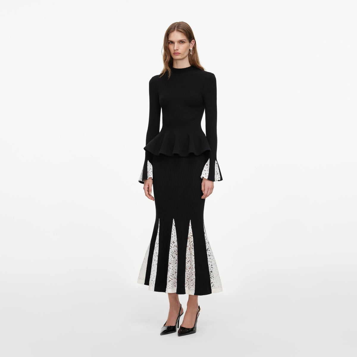 Side view of a woman wearing the Black Lace Insert Knit Midi Dress
