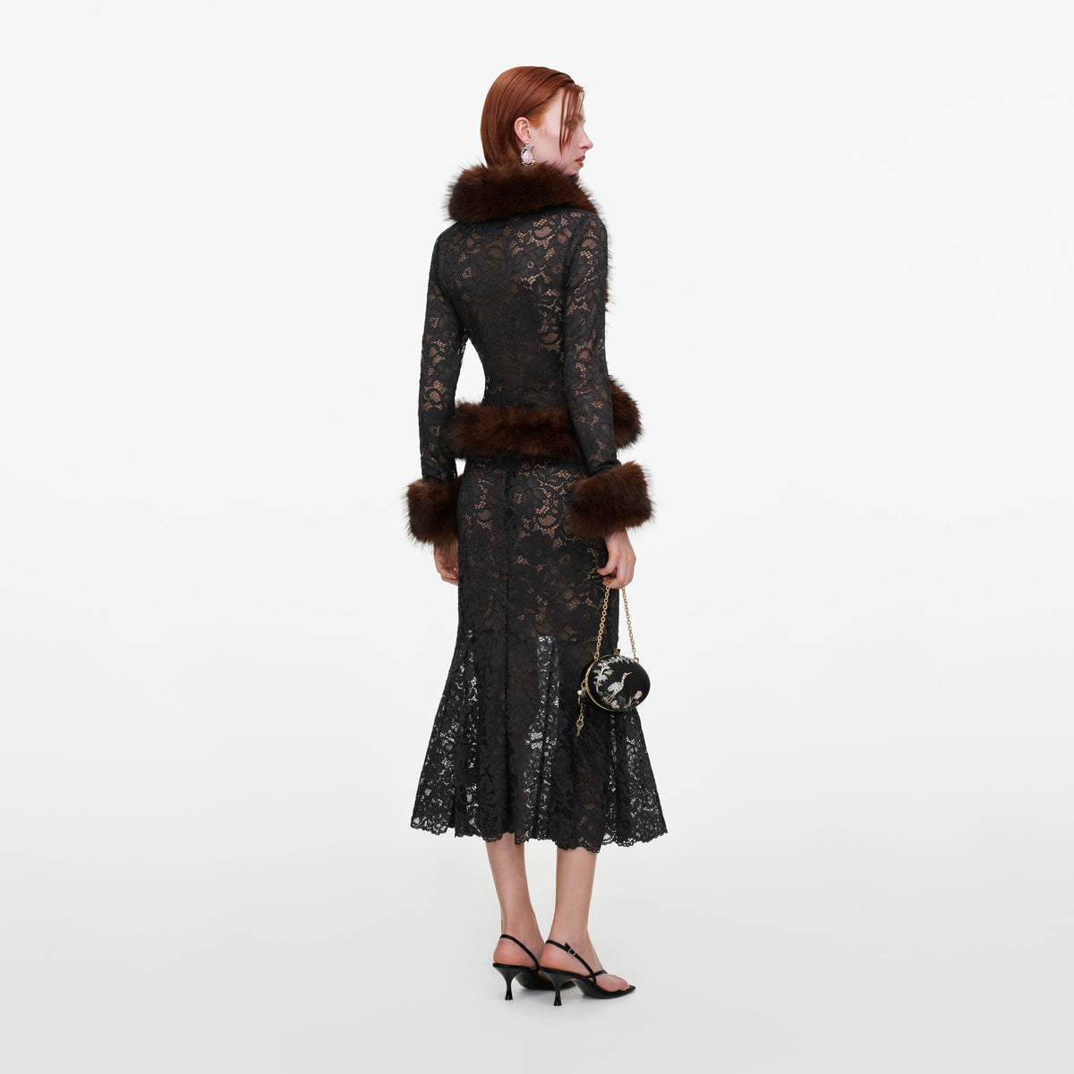 Back view of a woman wearing the Grey Lace Midi Skirt
