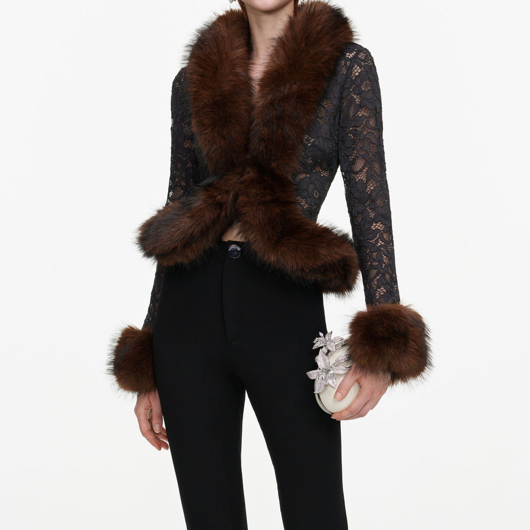 A close up of a woman wearing the Black Flared Knit Trousers