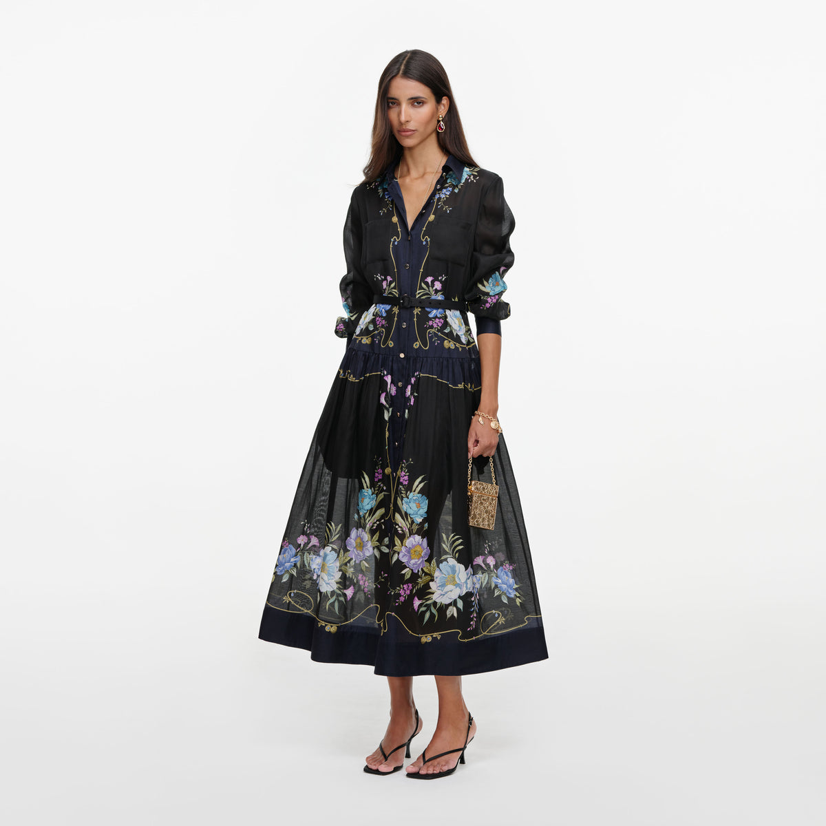 Side view of a woman wearing the Navy Floral Organza Midi Dress