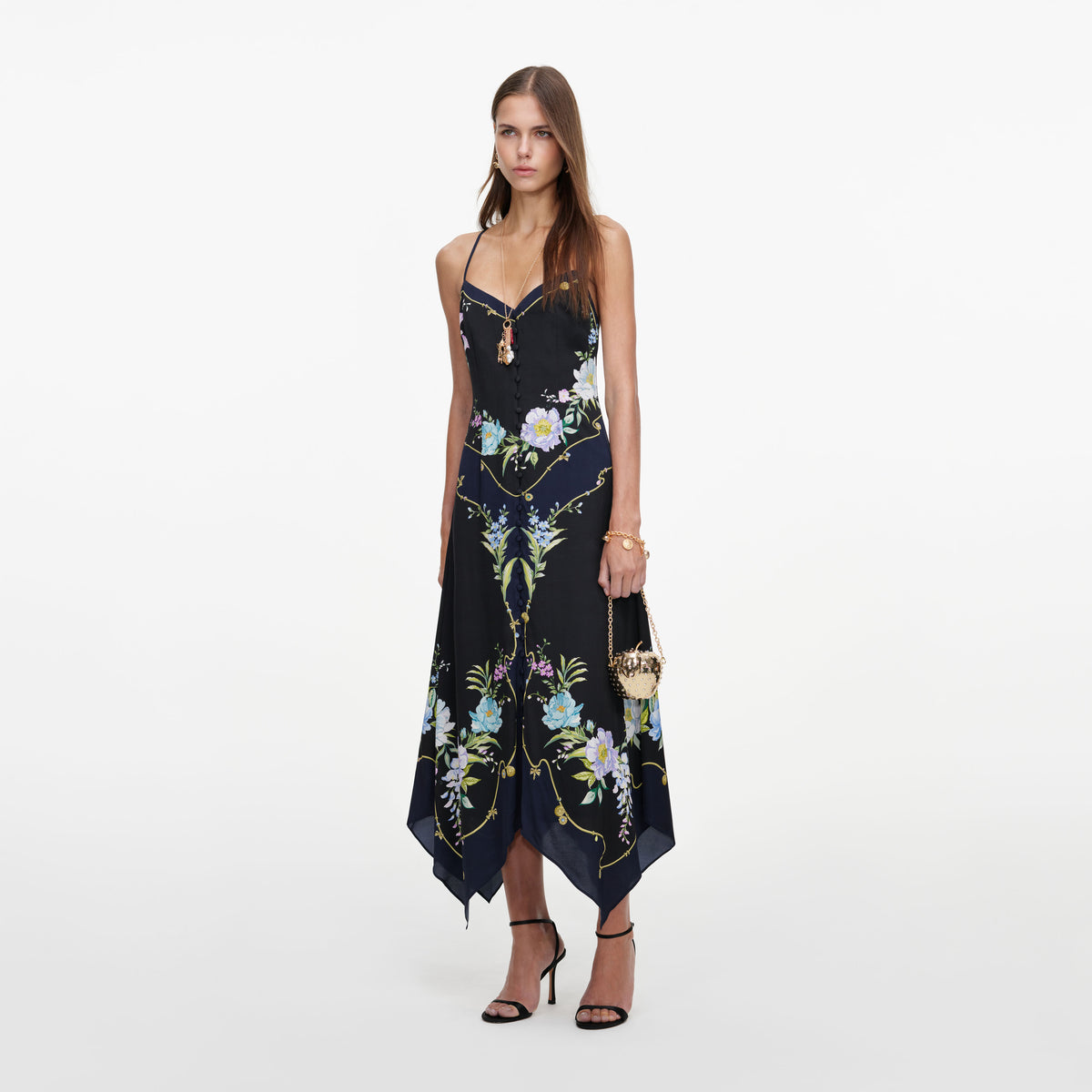 Side view of a woman wearing the Navy Floral Midi Dress