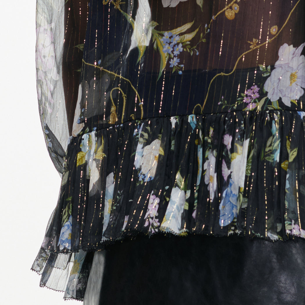 A close up of the fabric for the Navy Floral Ruffle Georgette Blouse