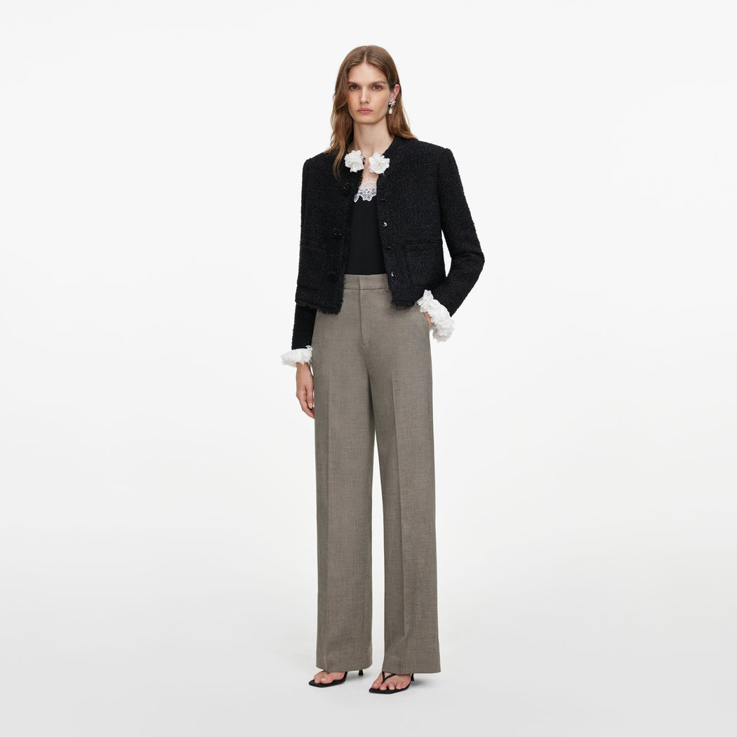 Side view of a woman wearing the Brown Twill Tailored Trousers