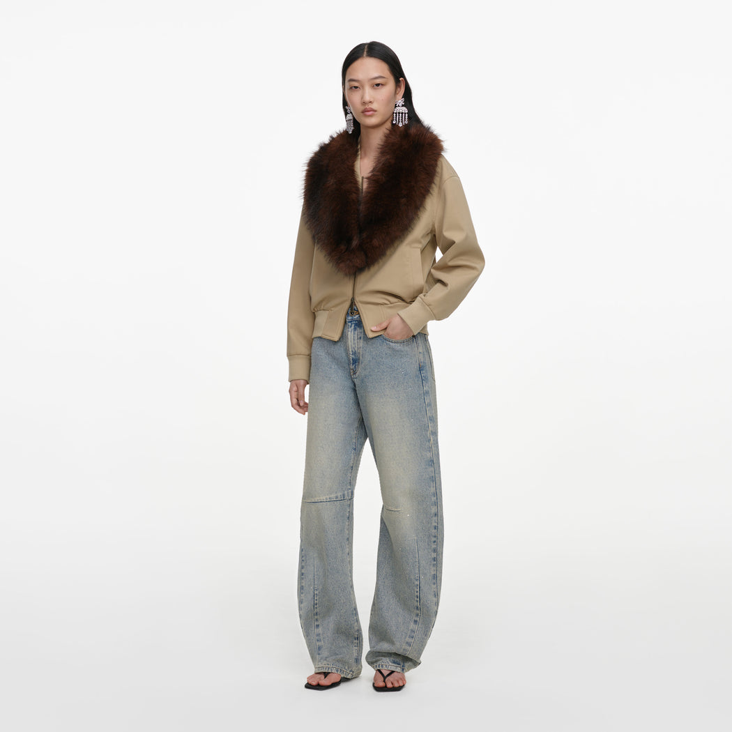 Side view of a woman wearing the Bleached Wash Jeans