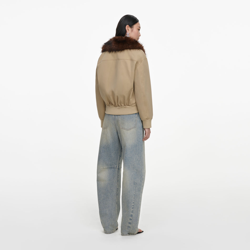 Back view of a woman wearing the Bleached Wash Jeans