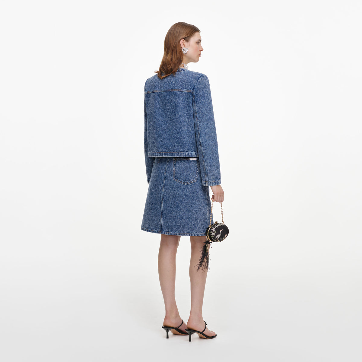 Back view of a woman wearing the Textured Denim Mini Skirt