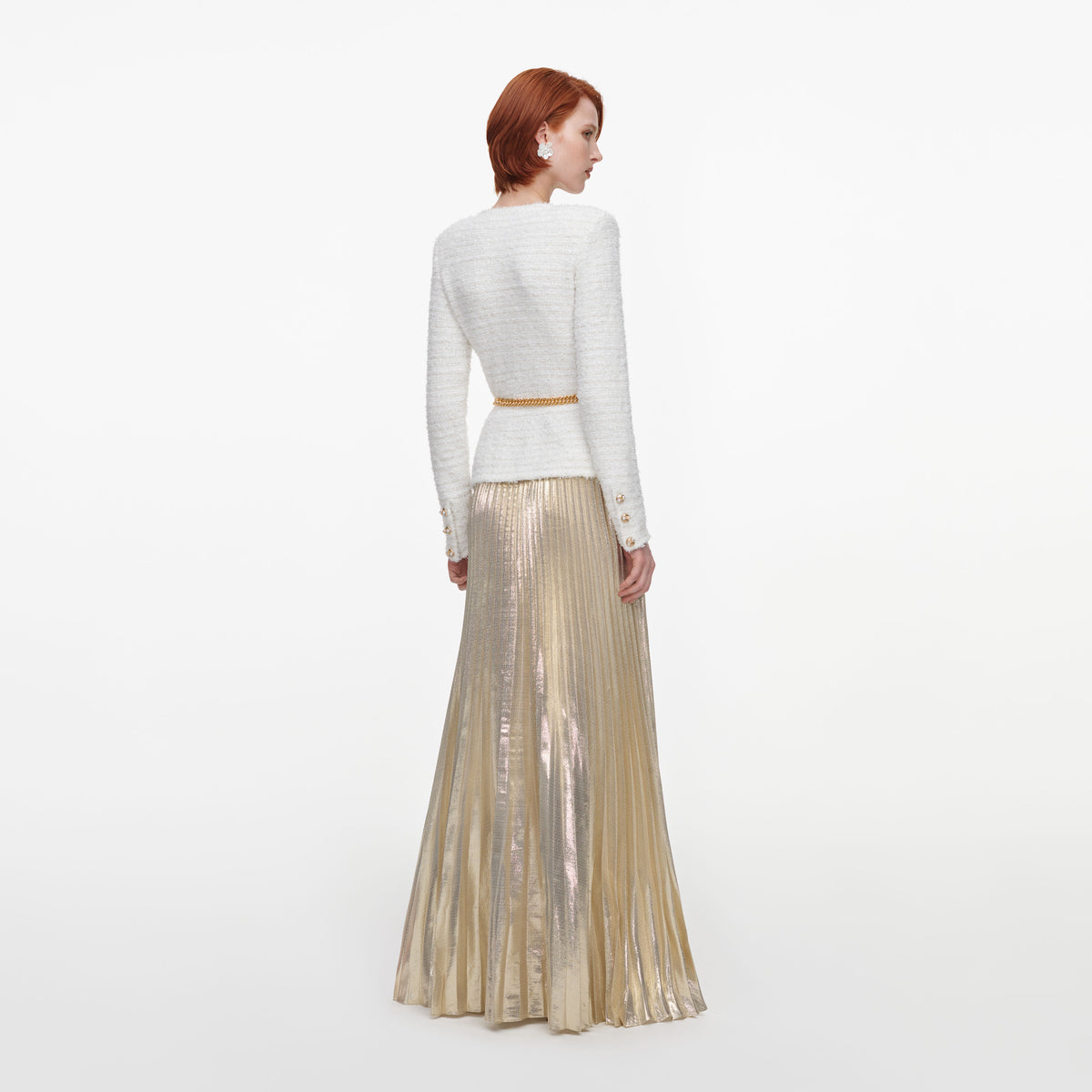 Back view of a woman wearing the Cream Textured Knit Metallic Chiffon Maxi Dress