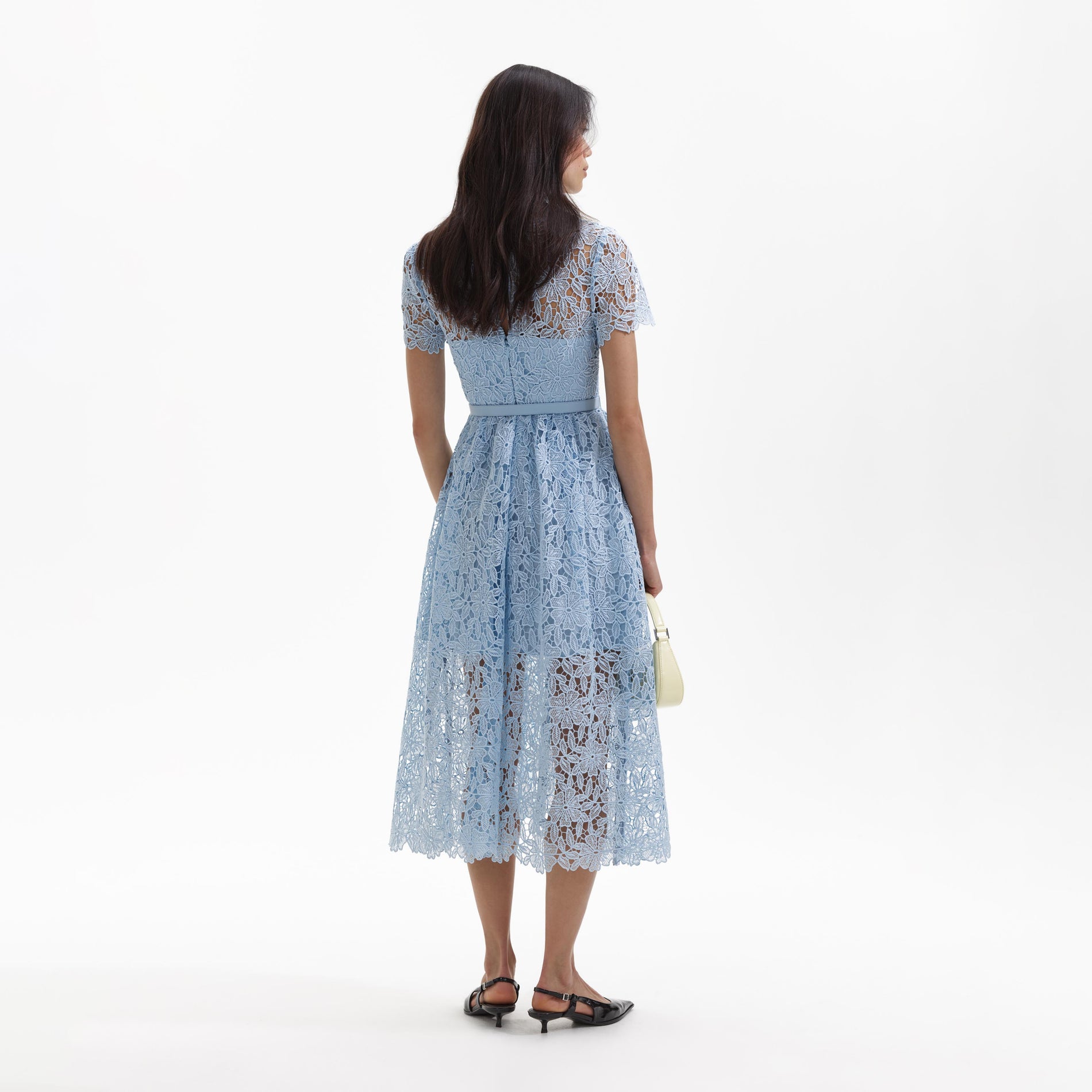 Back view of a woman wearing the Blue Lace Keyhole Midi Dress