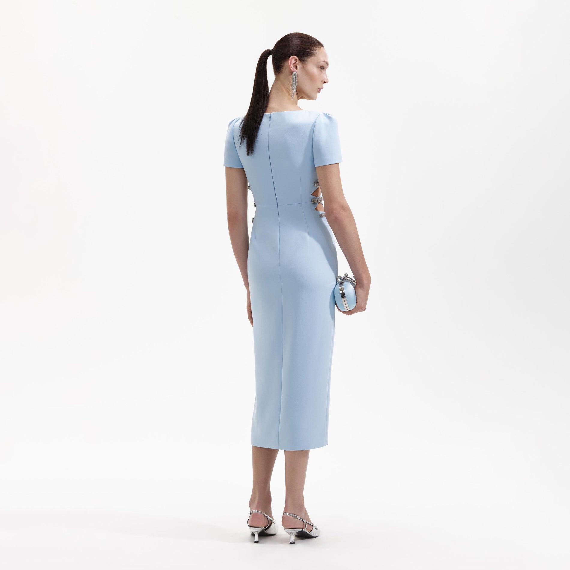 A Woman wearing the Blue Crepe Split Midi Dress