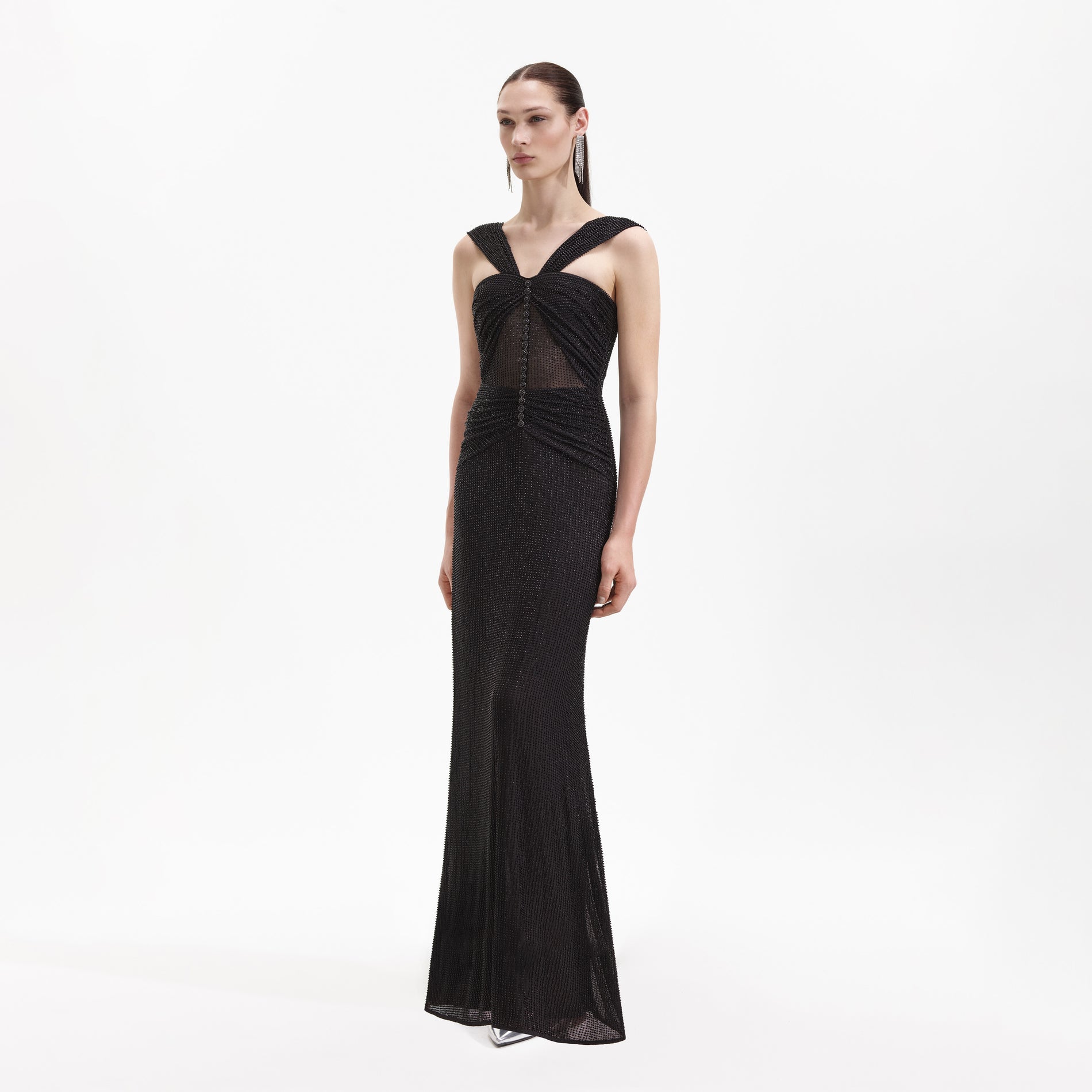 Side view of a woman wearing the Black Beaded Mesh Maxi Dress