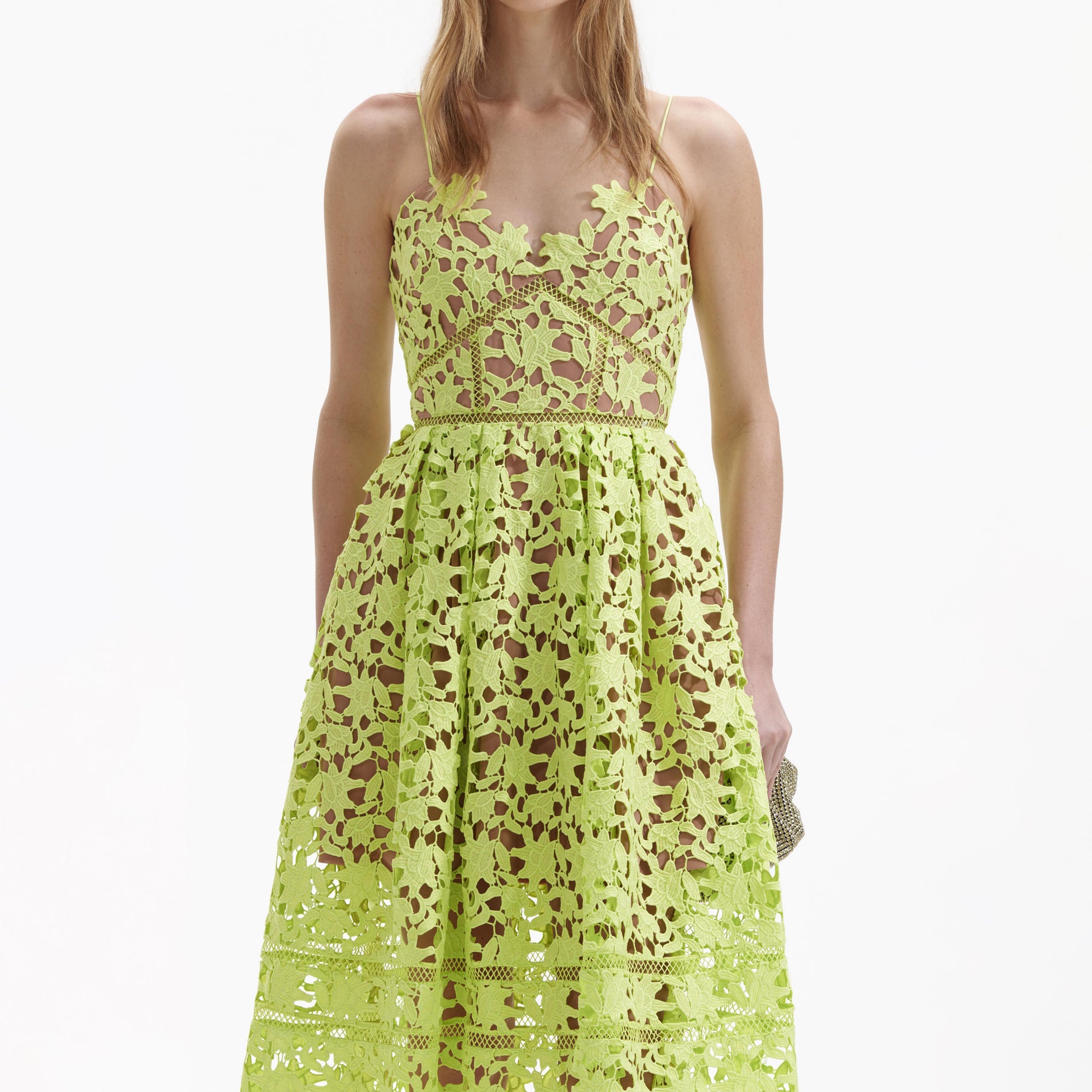 A close up of a woman wearing the Lime Azaelea Lace Midi Dress