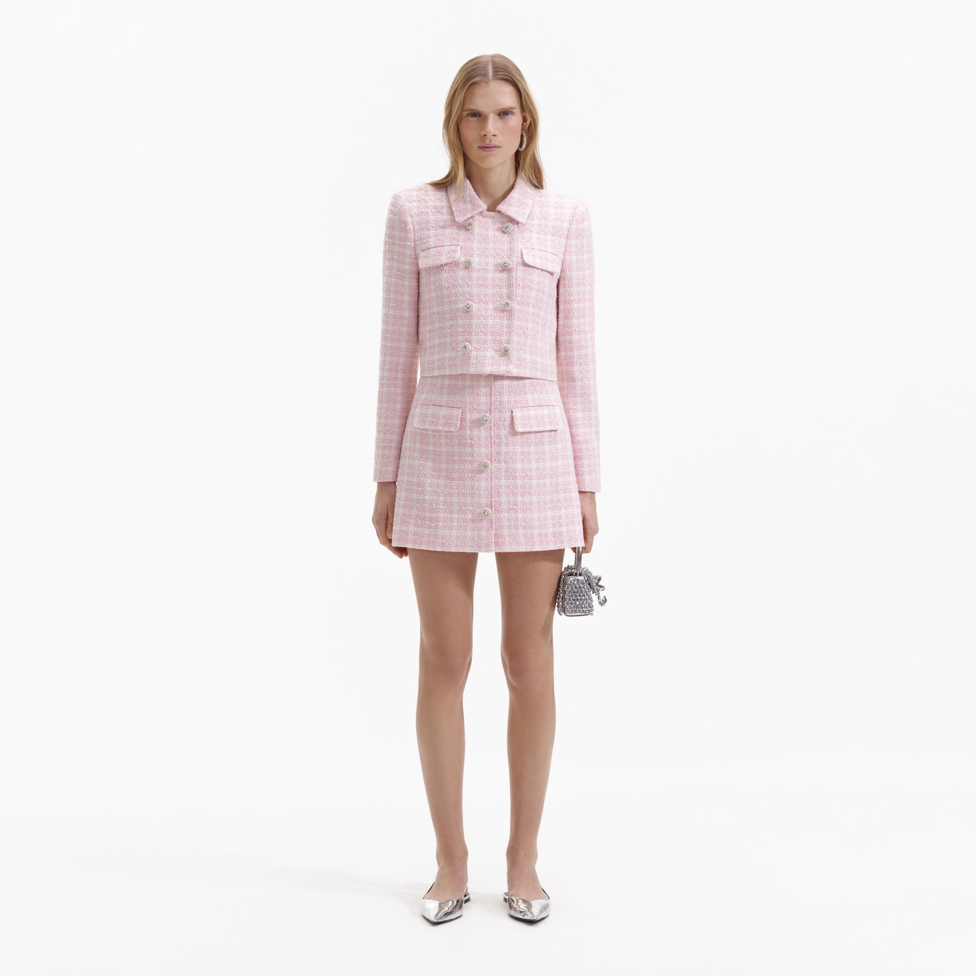 A Woman wearing the Pink Boucle Button Mini Skirt