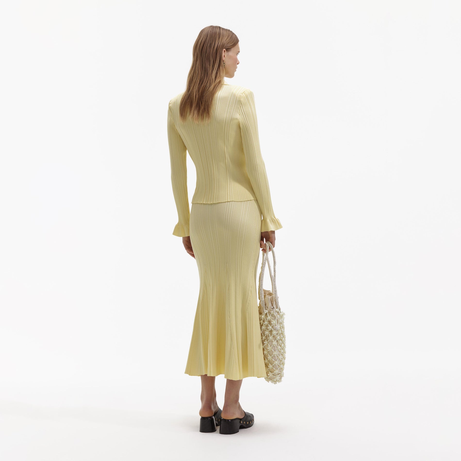 A Woman wearing the Yellow Ribbed Viscose Knit Top