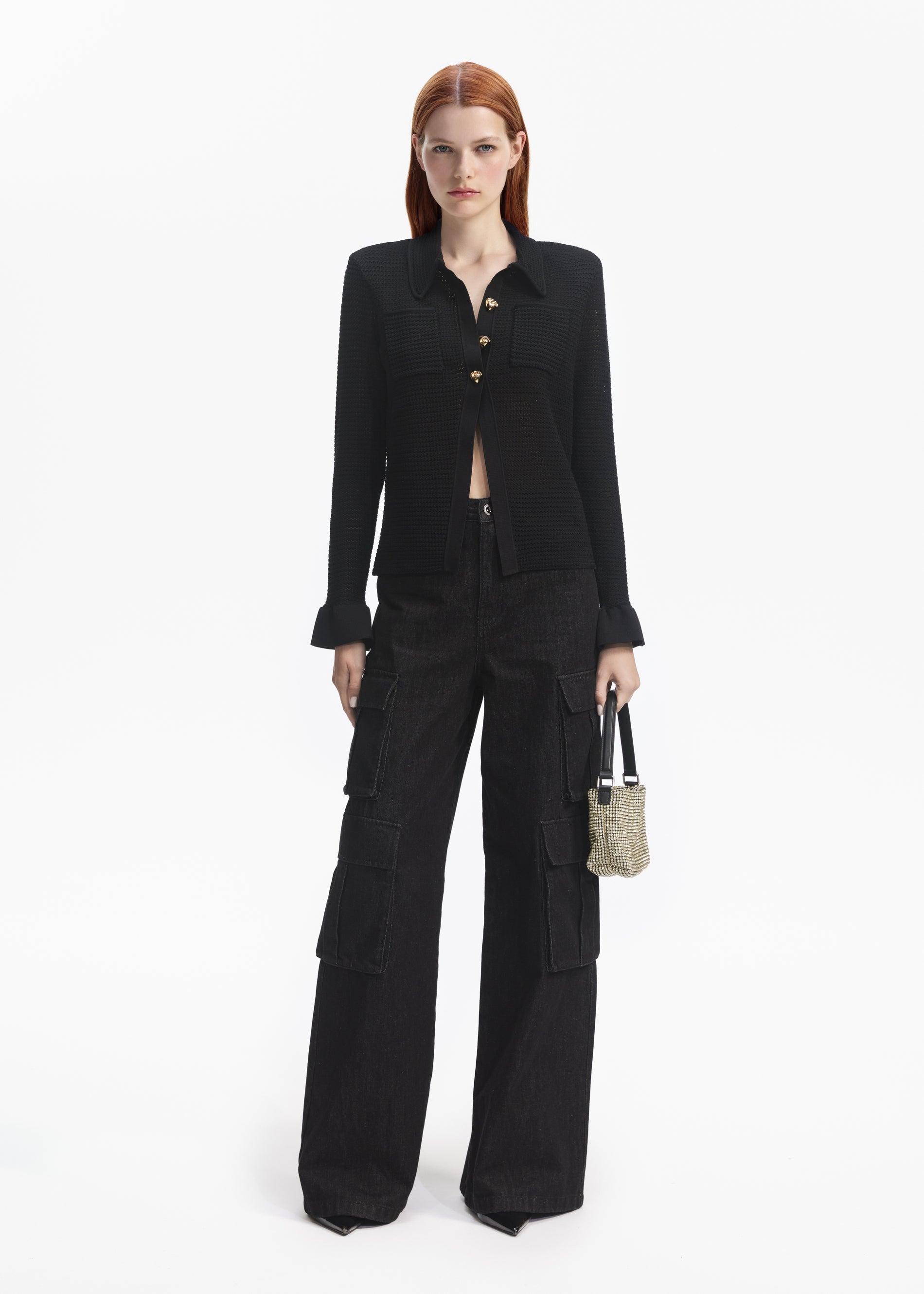 Front view of a woman wearing the Black Sequin Pointelle Knit Top