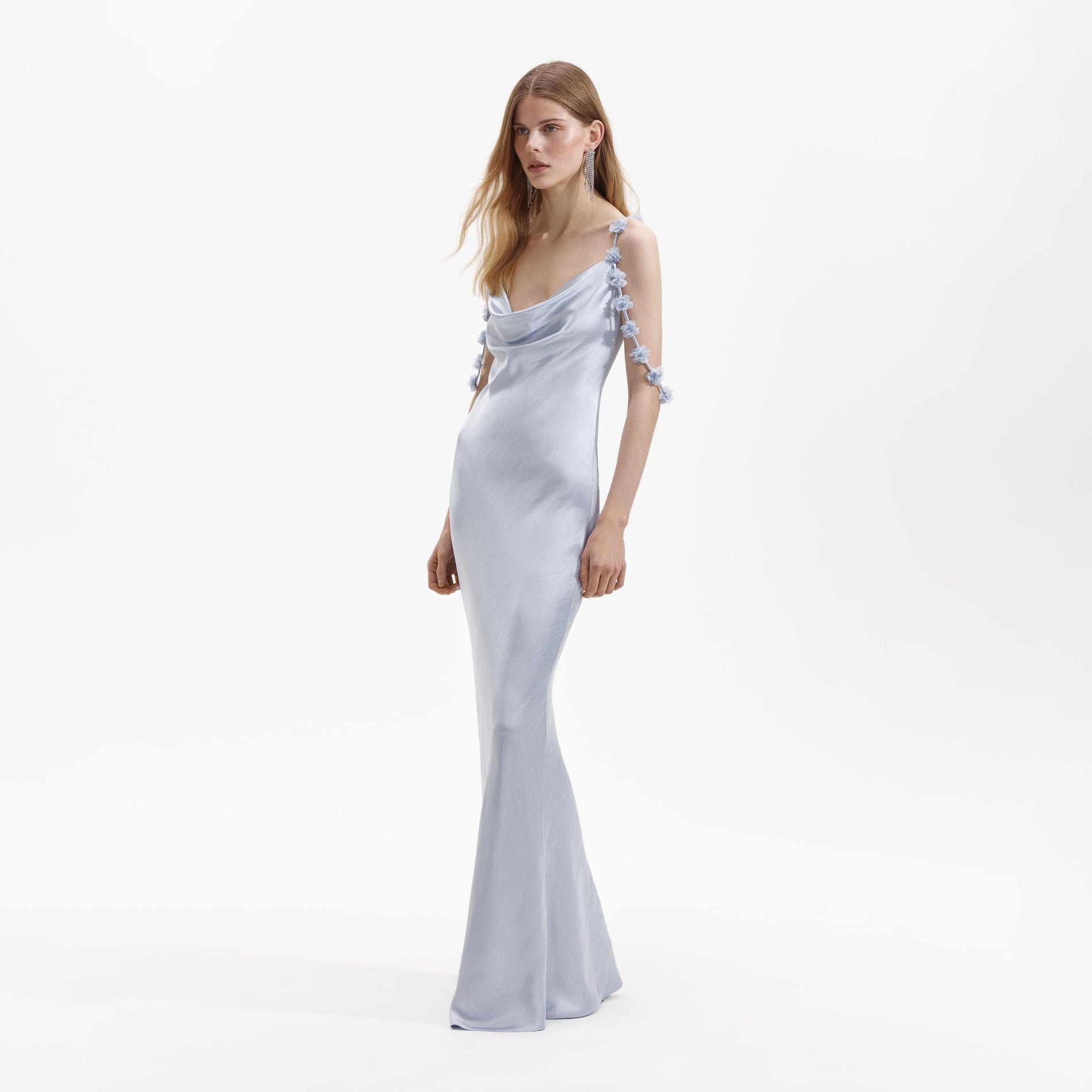 Side view of a woman wearing the Blue Satin Flower Maxi Dress