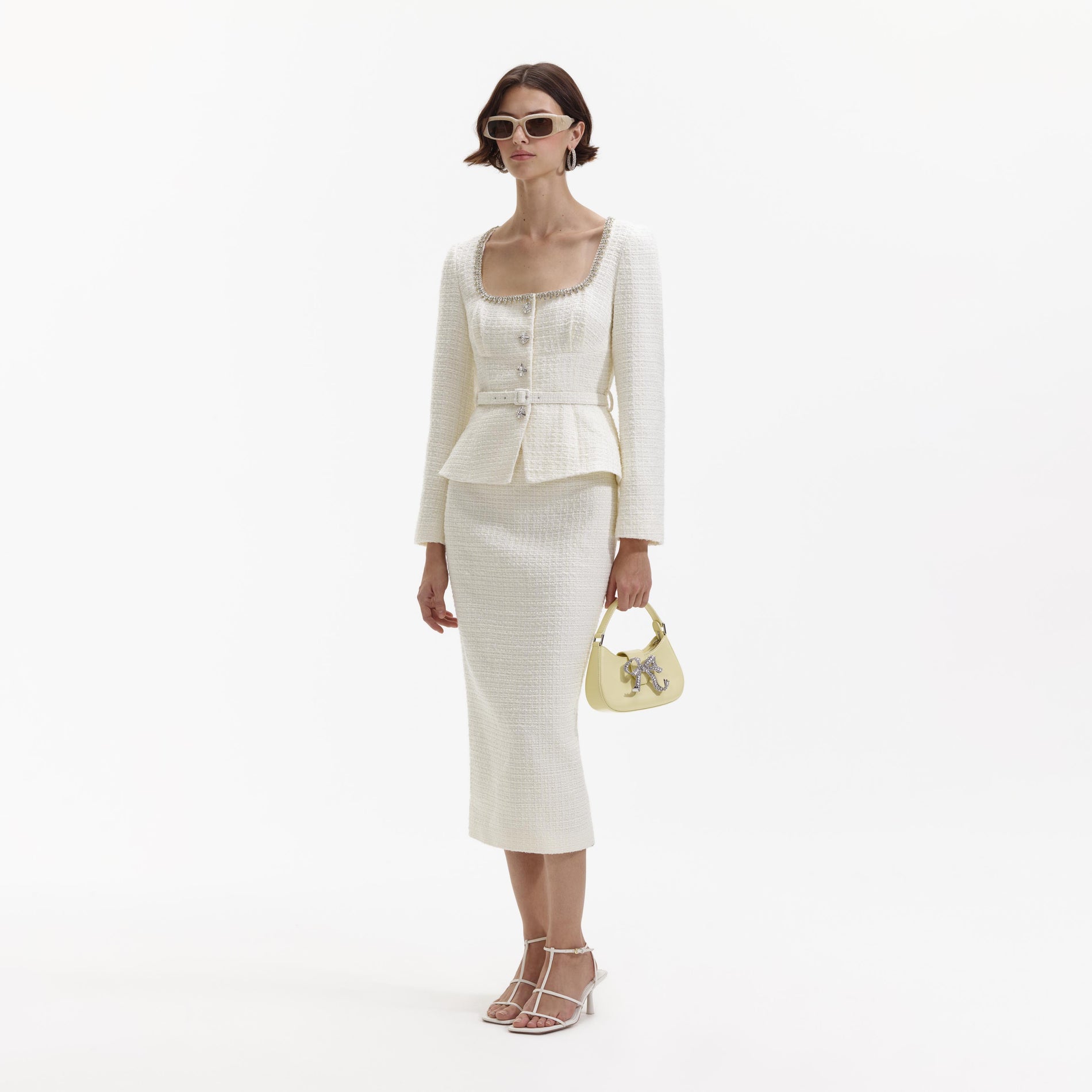 Side view of a woman wearing the Cream Boucle Diamante Trim Midi Dress