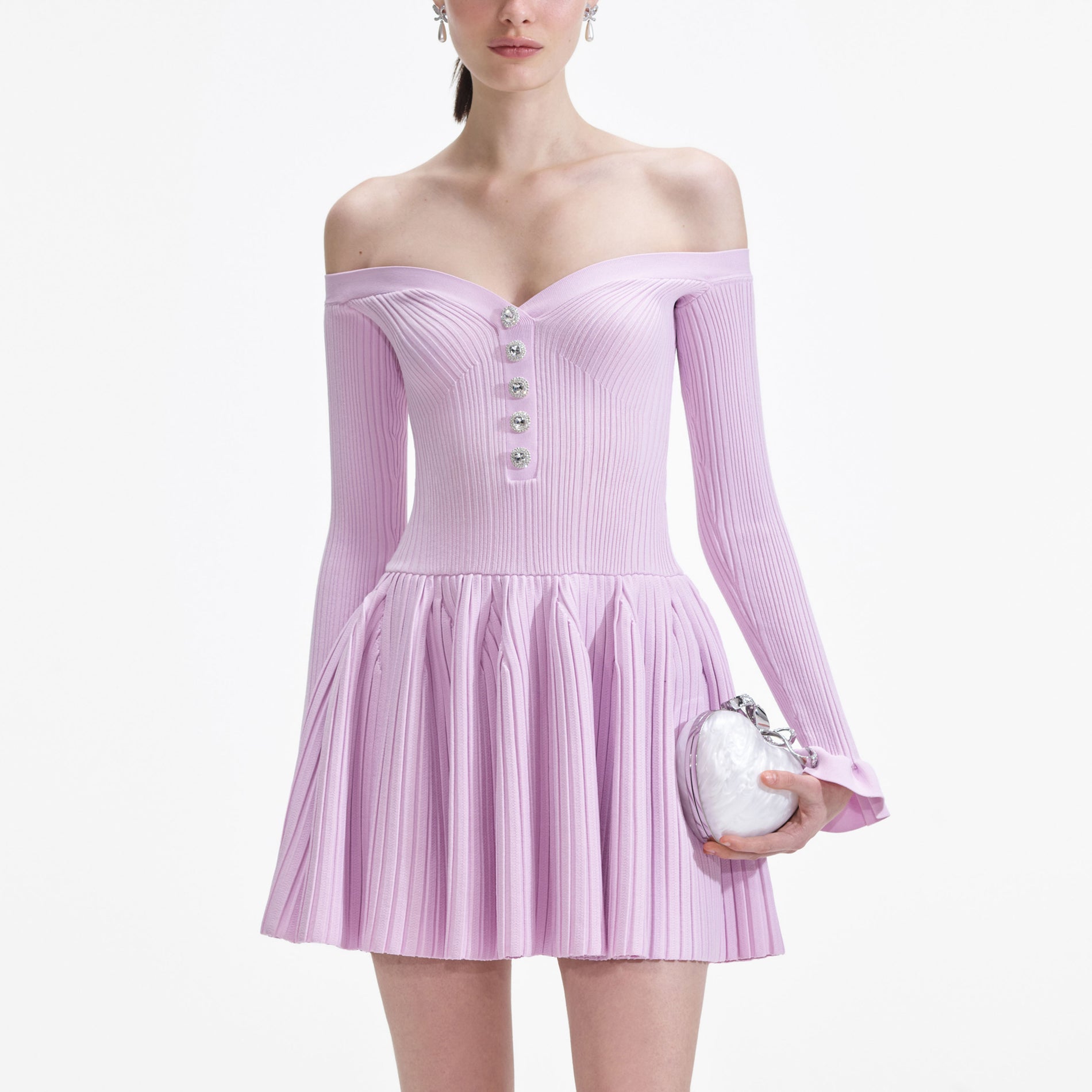 A close up of a woman wearing the Pink Ribbed Knit Mini Dress