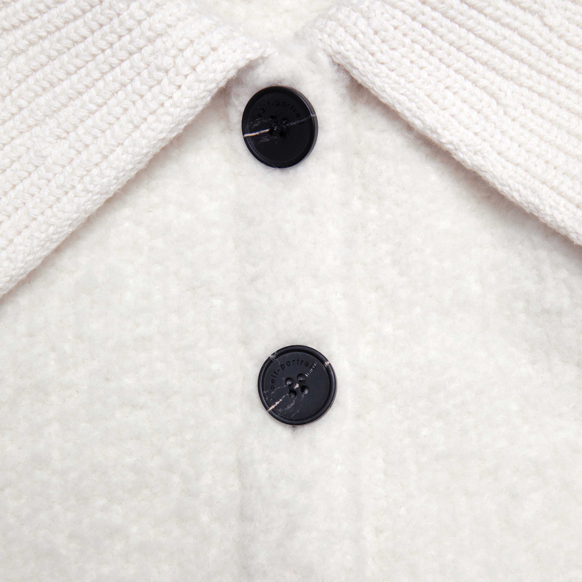 Side view of a woman wearing the Cream Fluffy Knit Cardigan