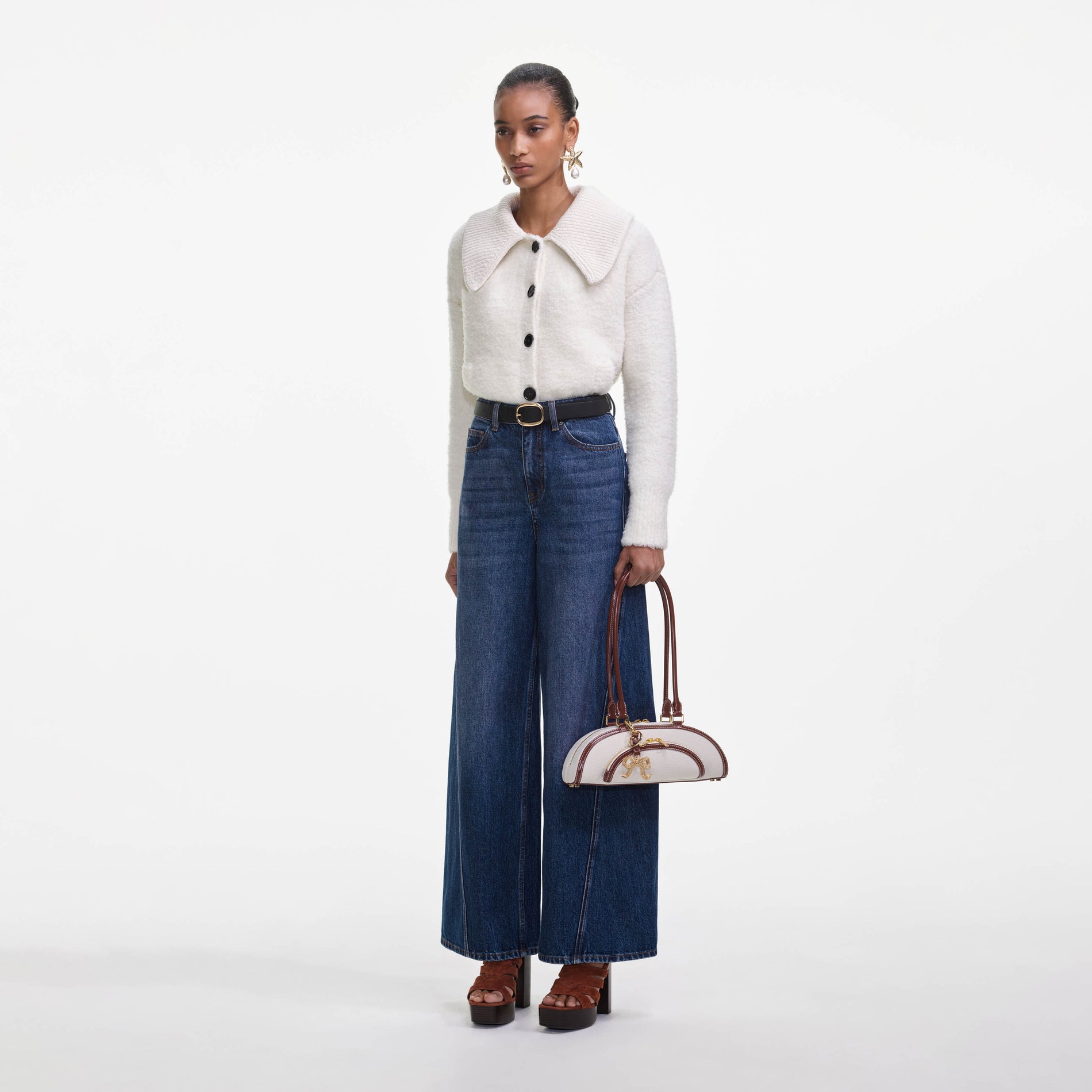 Side view of a woman wearing the Cream Fluffy Knit Cardigan