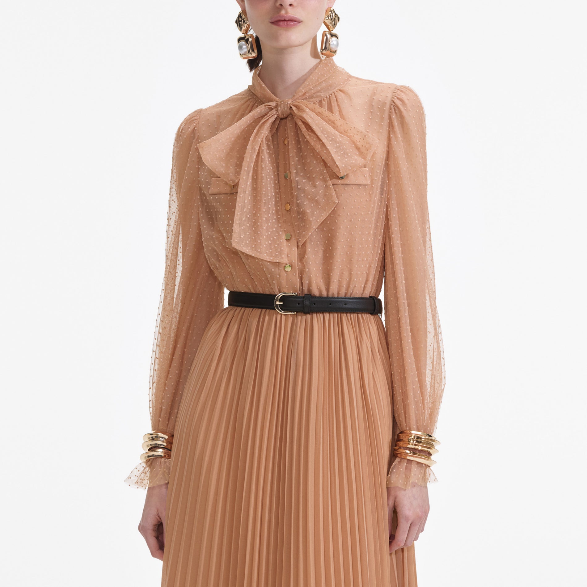 A close up of a woman wearing the Tan Dot Mesh Maxi Dress