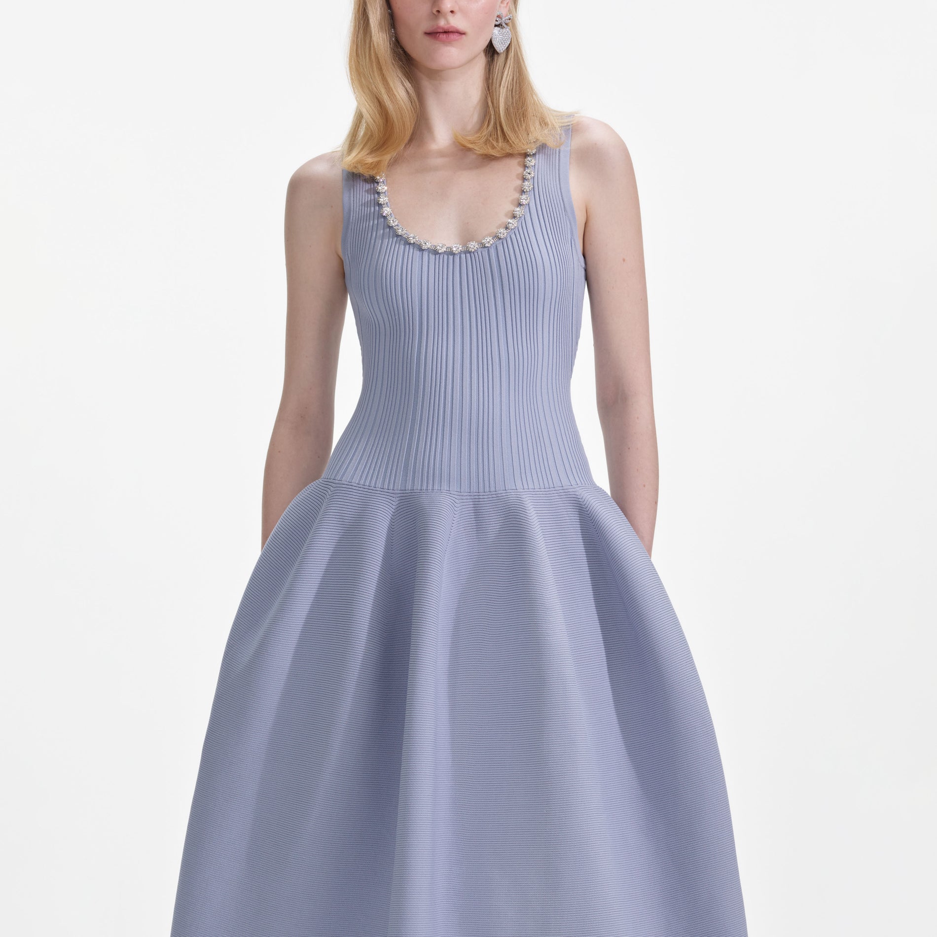 A close up of a woman wearing the Blue Ribbed Knit Diamante Midi Dress