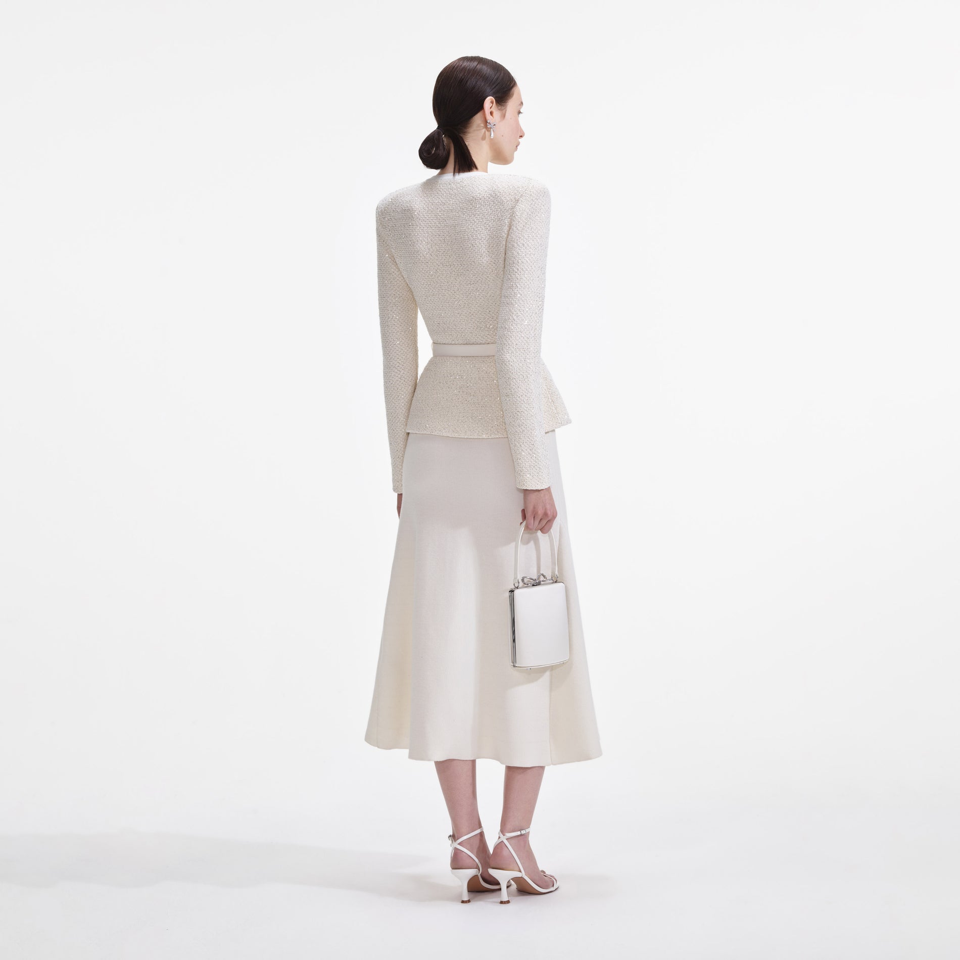 Back view of a woman wearing the Cream Sequin Knit Tailored Midi Dress