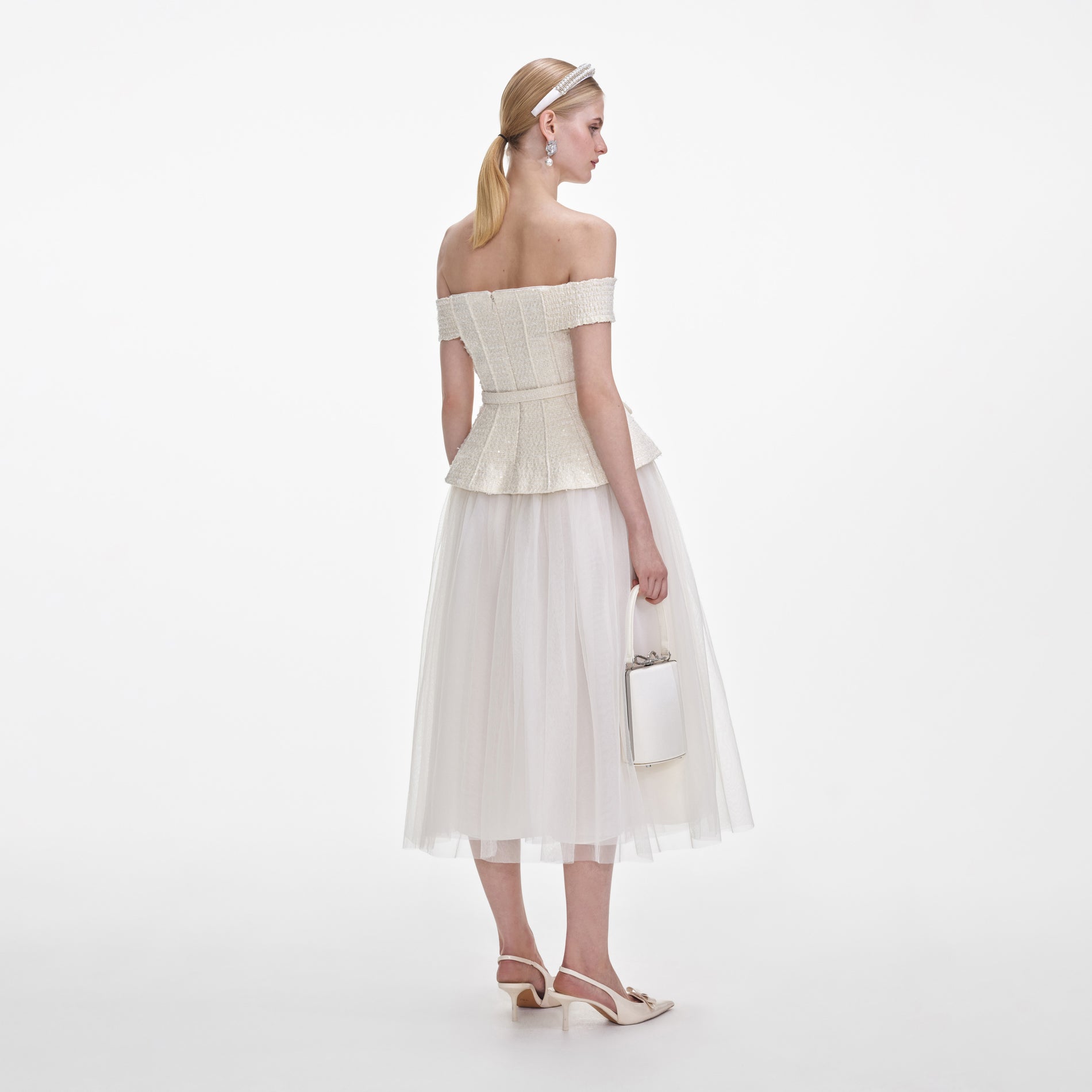 Back view of a woman wearing the Cream Boucle Tulle Midi Dress