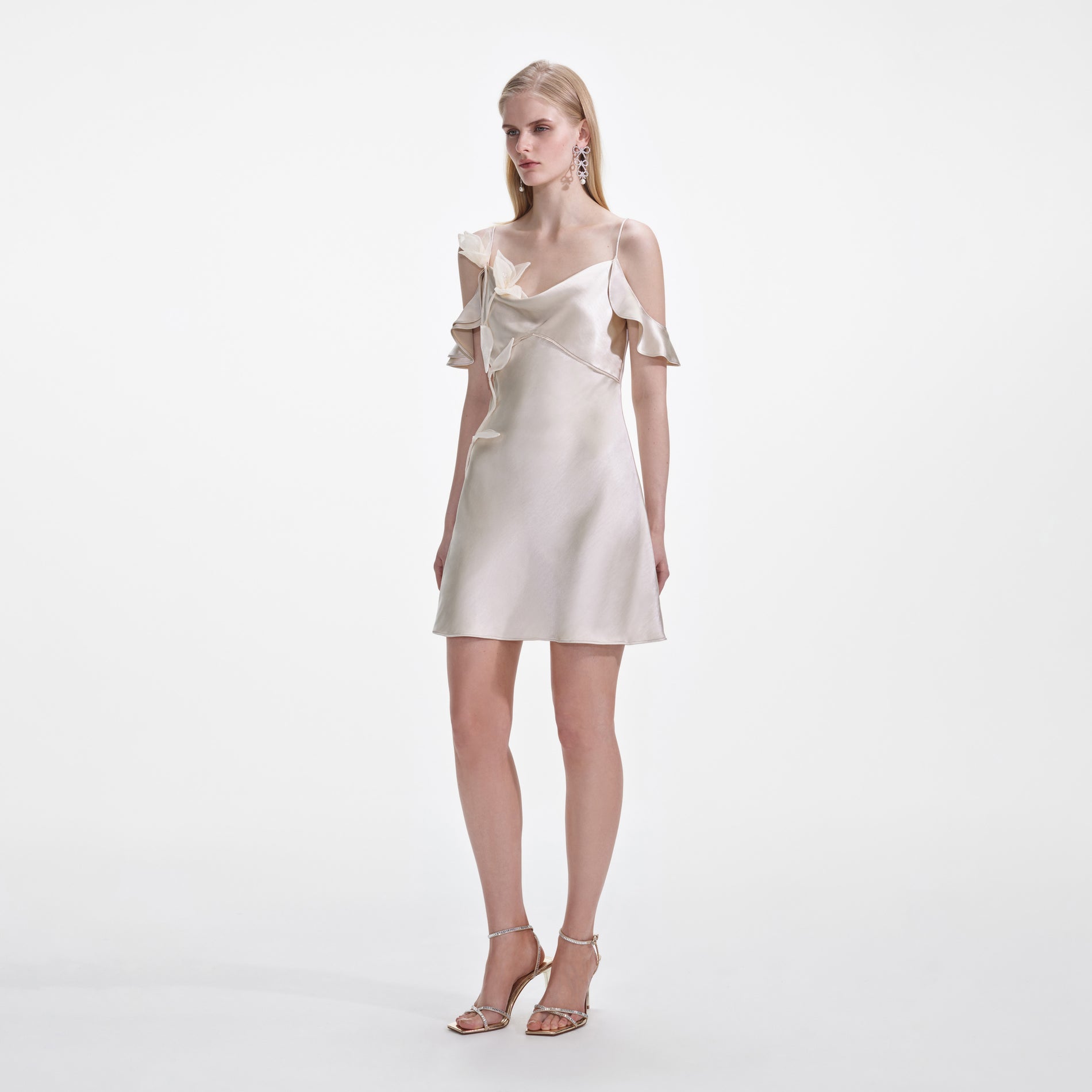 Side view of a woman wearing the Champagne Flower Satin Mini Dress