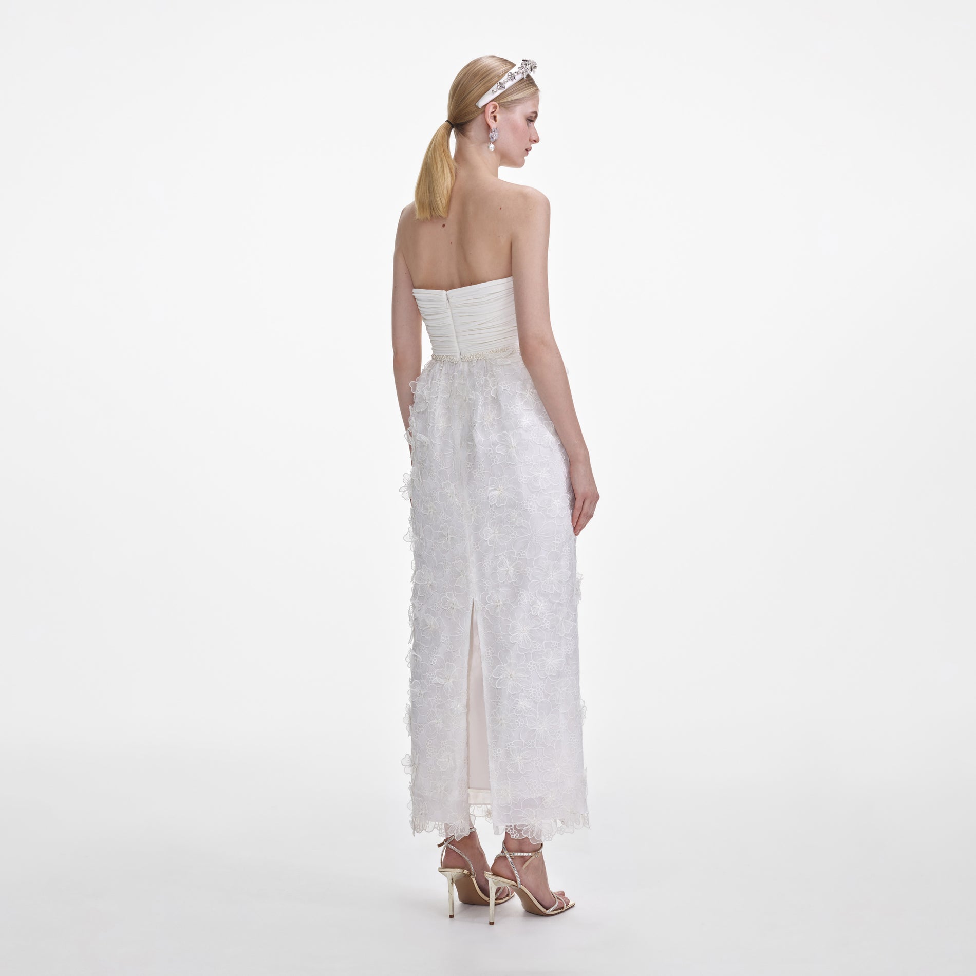 Back view of a woman wearing the White Organza Bandeau Midi Dress