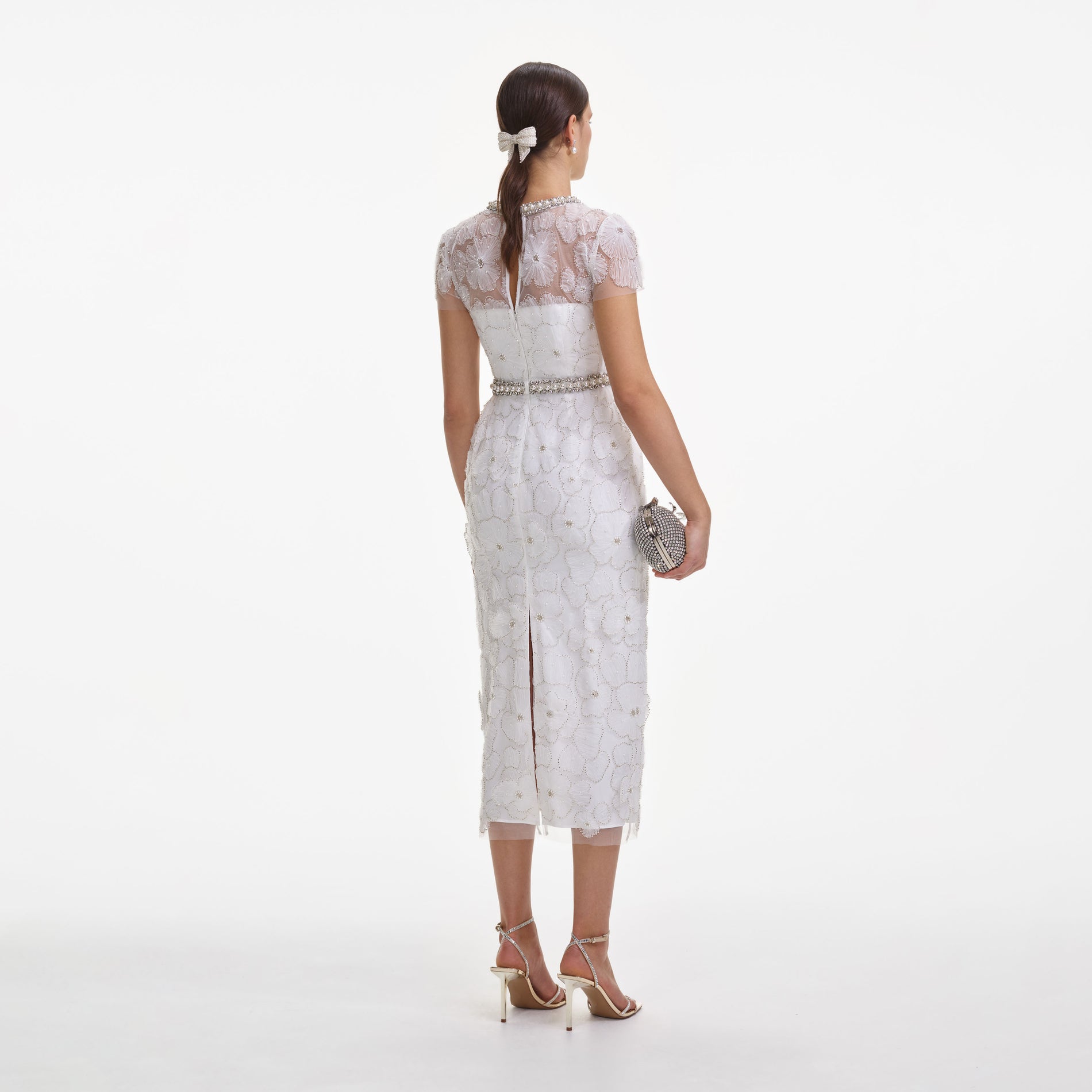 Back view of a woman wearing the White Embellished Tulle Midi Dress