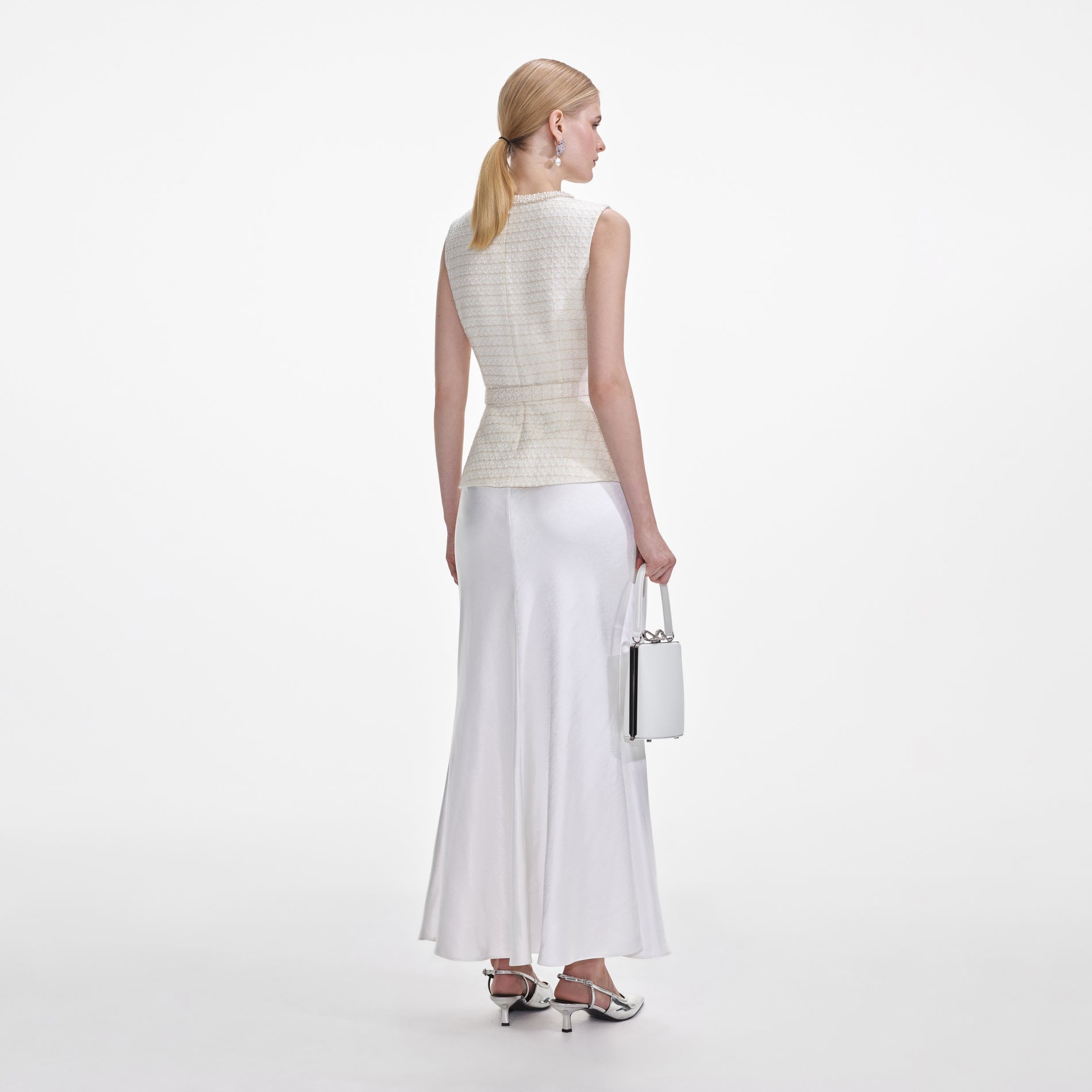 Back view of a woman wearing the Cream Boucle Midi Dress