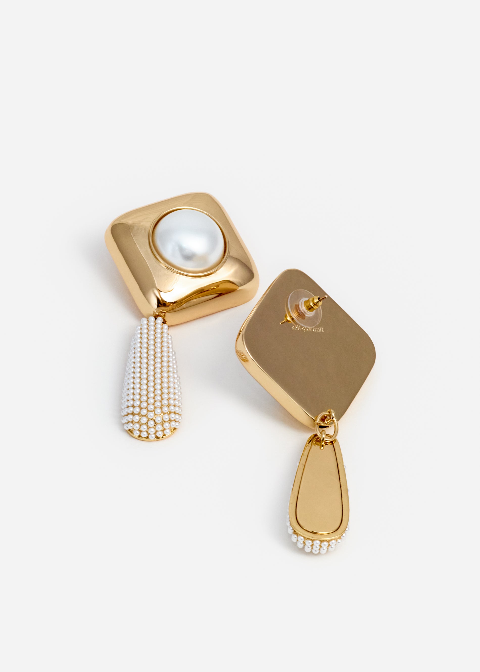 A photo of the Gold Pearl Crystal Bar Earrings