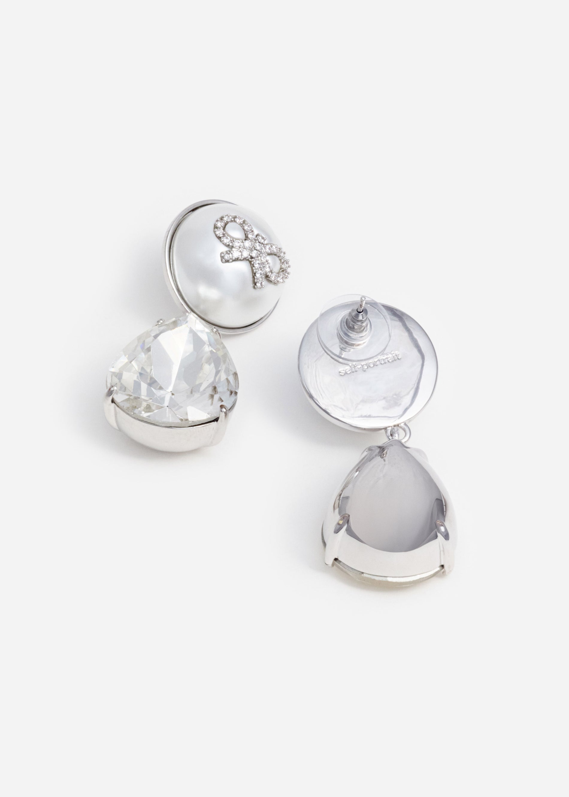 A photo of the Bow Pearl Crystal Droplet Earrings