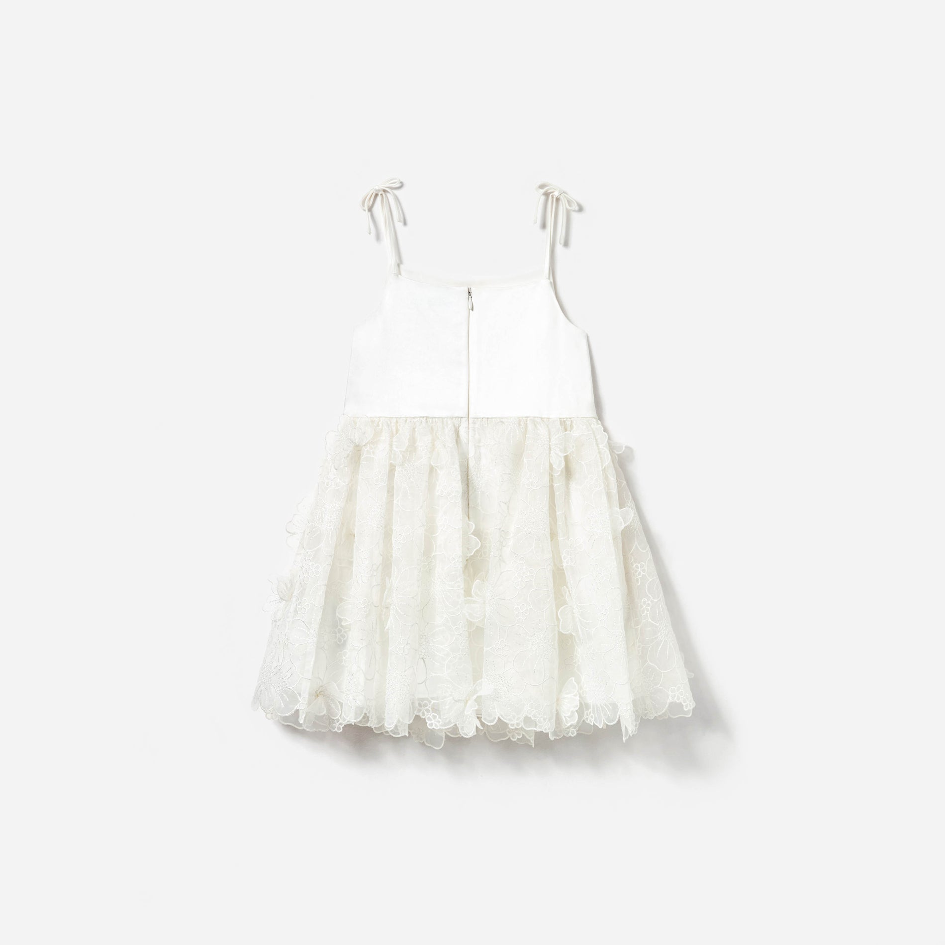 Side view of a woman wearing the White Embellished Tulle Dress