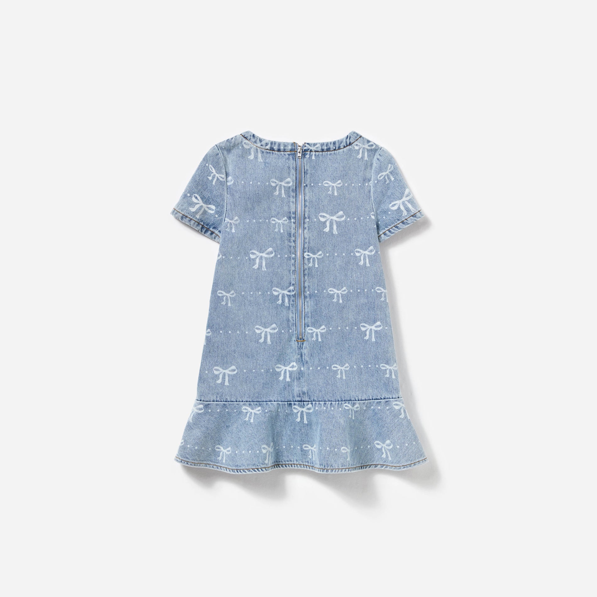Side view of a woman wearing the Light Blue Bow Denim Dress