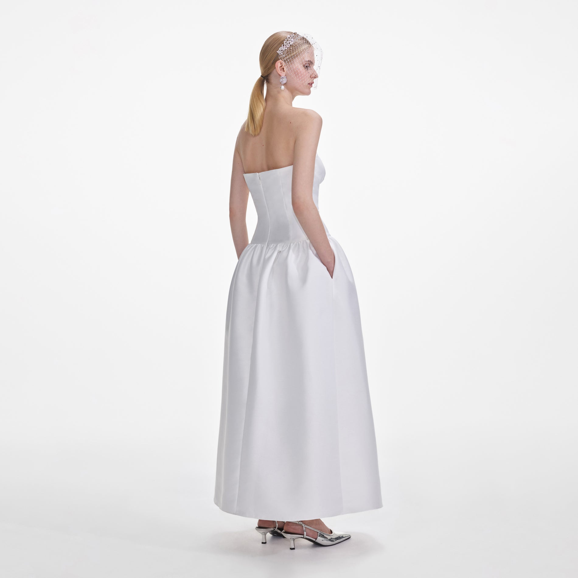 Back view of a woman wearing the White Taffeta Maxi Dress