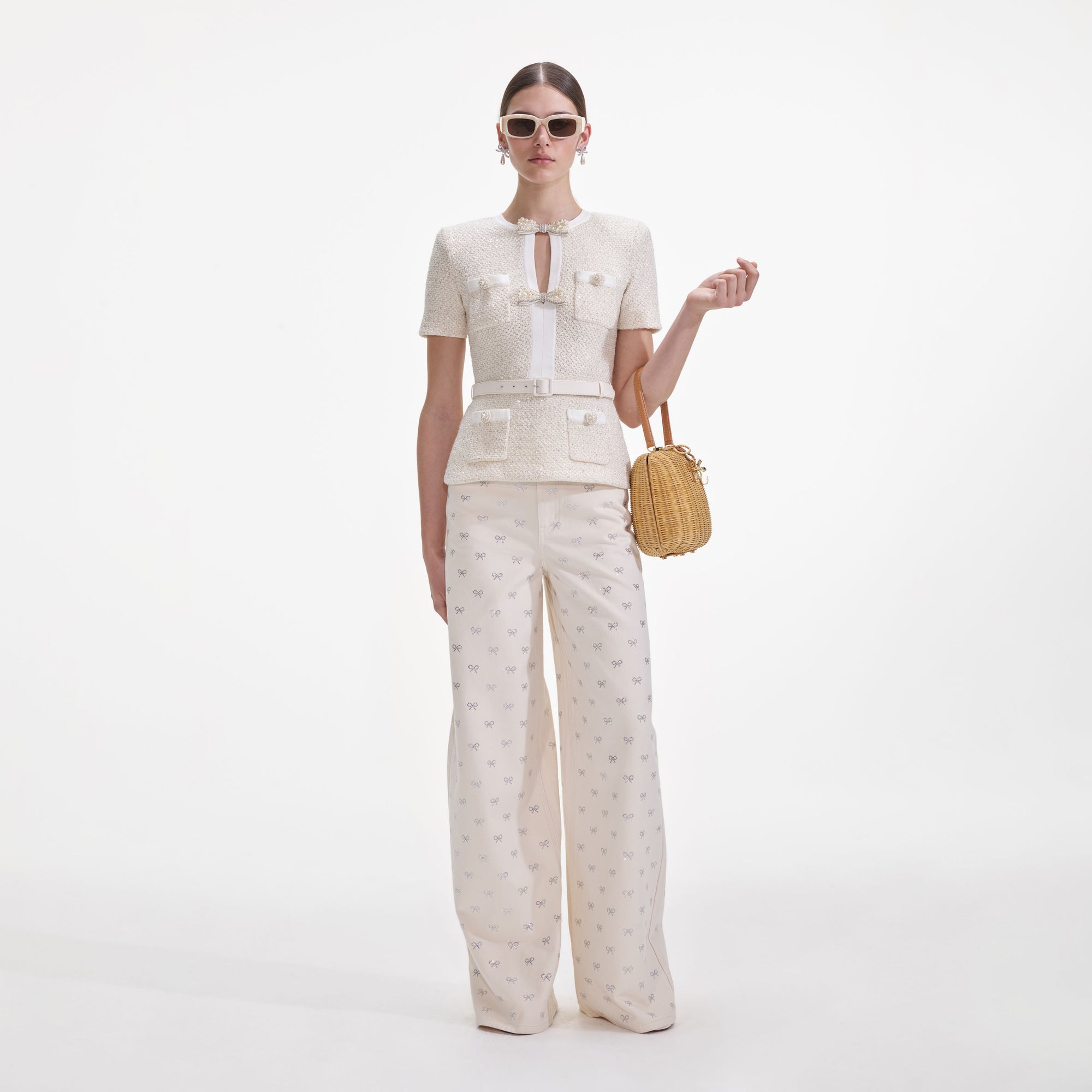 Front view of a woman wearing the Cream Sequin Knit Top